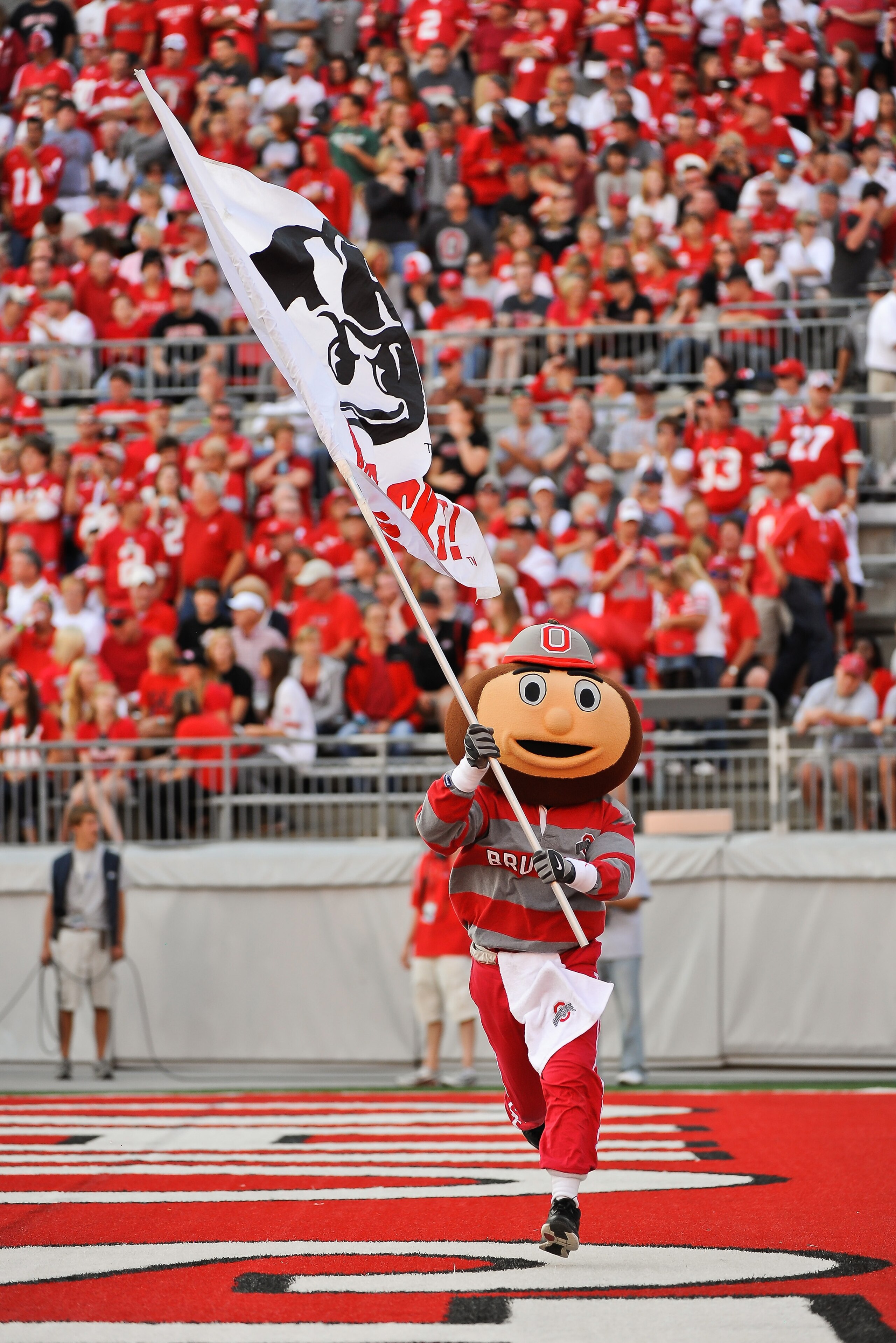 COLUMBUS, OH - SEPTEMBER 25:  Ohio State Buckeyes mascot Brutus Buckeye carries a flag during a game against the Eastern Michigan Eagles at Ohio Stadium on September 25, 2010 in Columbus, Ohio.  Ohio State won 73-20. (Photo by Jamie Sabau/Getty Images)