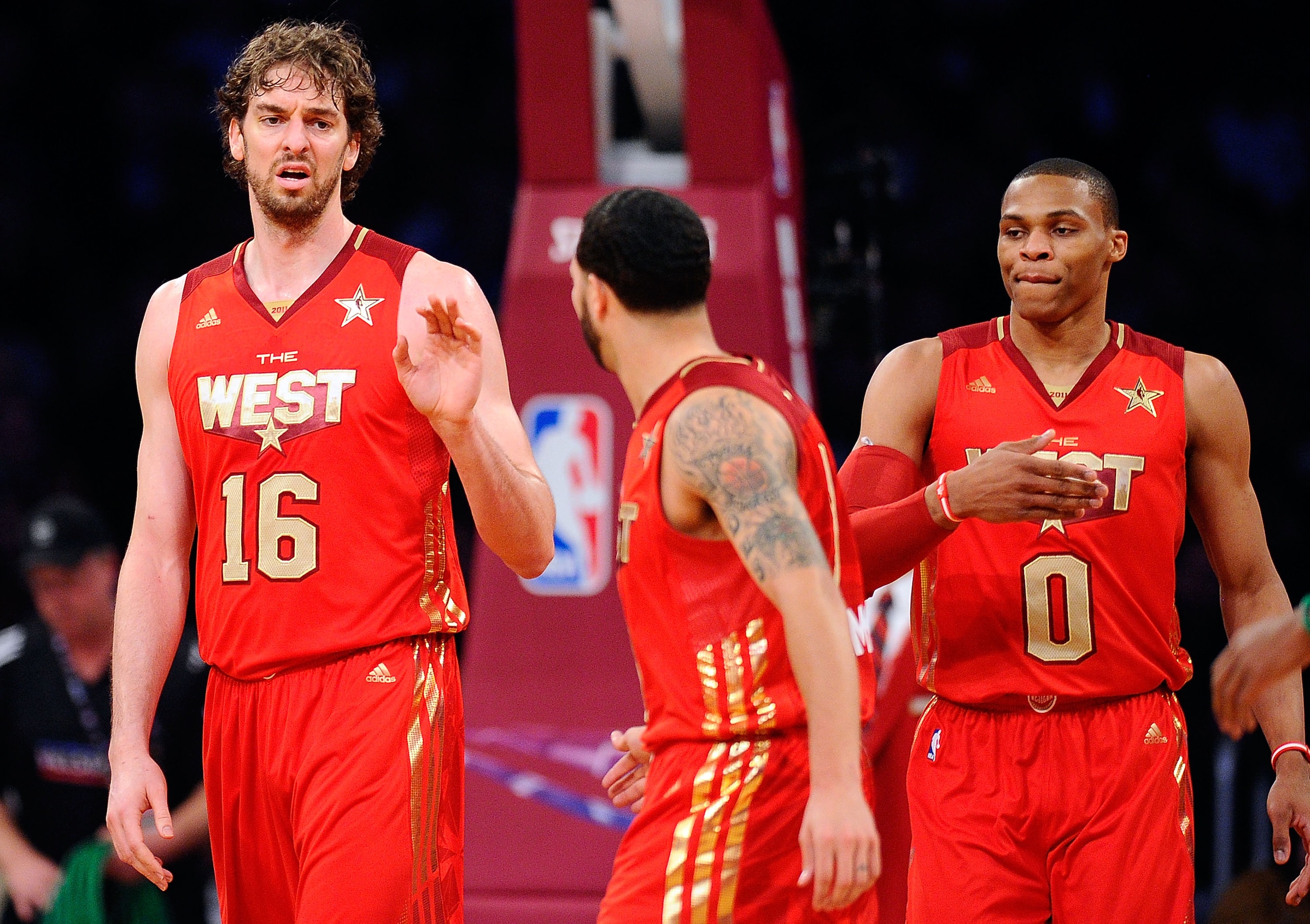 LOS ANGELES, CA - FEBRUARY 20:  Pau Gasol #16 of the Los Angeles Lakers  and the Western Conference reacts with Deron Williams #8 of the Utah Jazz and the Western Conference and Russell Westbrook #0 of the Oklahoma City Thunder and the Western Conference 