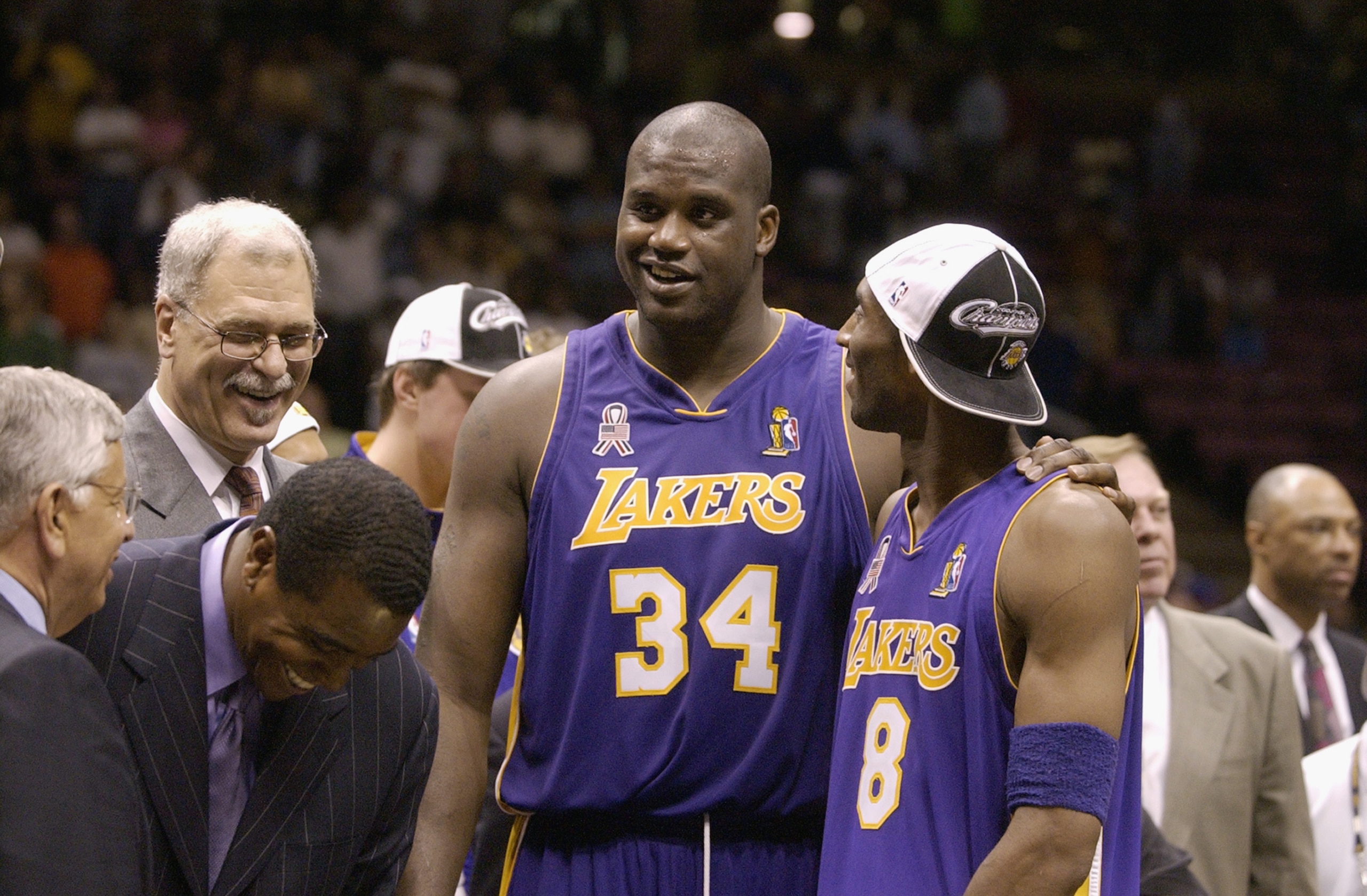 EAST RUTHERFORD, NJ - JUNE 12: Shaquille O'Neal #34  and Kobe Bryant #8 of the Los Angeles Lakers celebrate after defeating the New Jersey Nets in Game four of the 2002 NBA Finals at Continental Airlines Arena in East Rutherford, New Jersey on June 12, 20