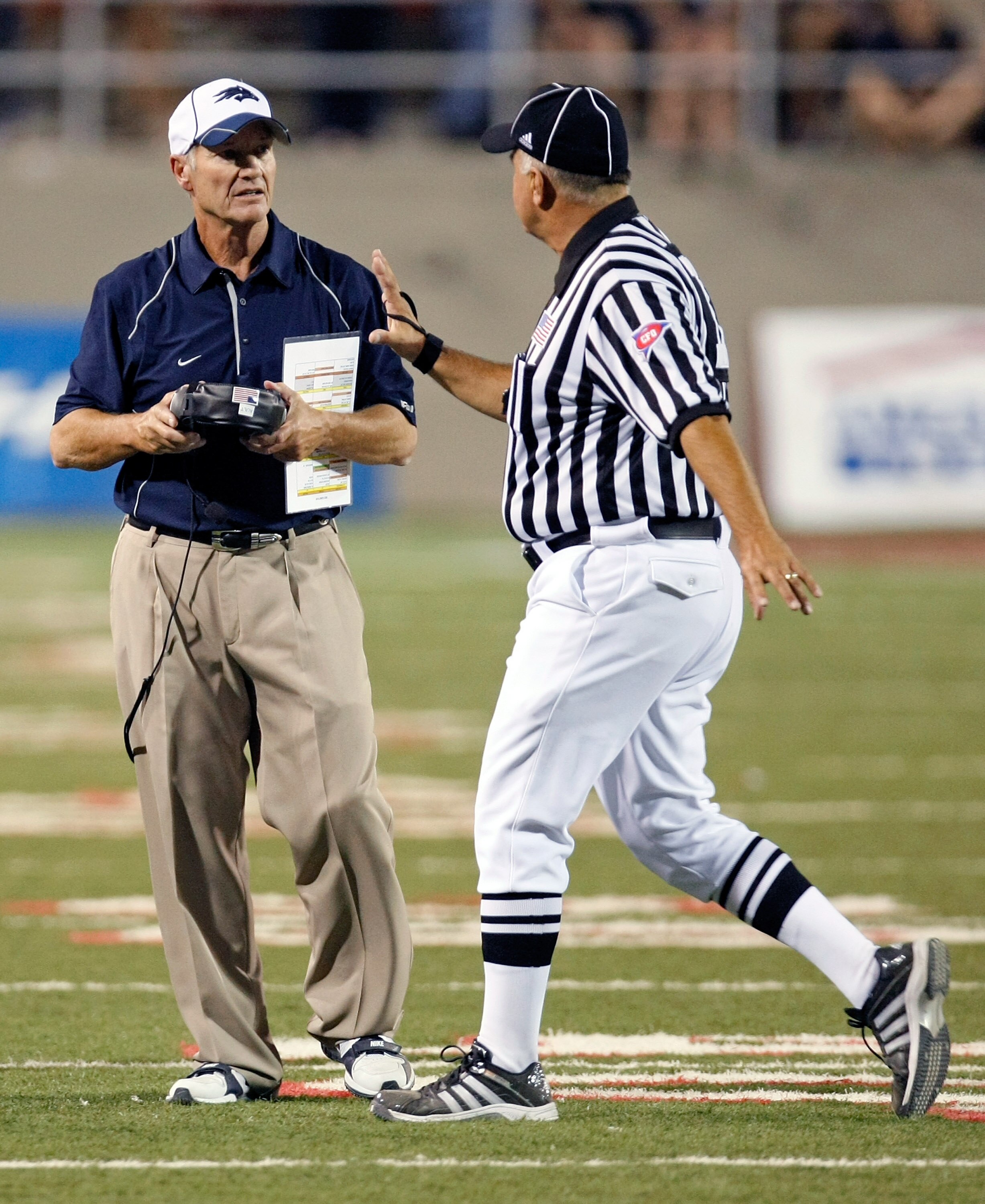LAS VEGAS - OCTOBER 02:  Nevada Reno Wolf Pack head coach Chris Ault talks to an official during a game against the UNLV Rebels at Sam Boyd Stadium October 2, 2010 in Las Vegas, Nevada. Nevada Reno won 44-26.  (Photo by Ethan Miller/Getty Images)