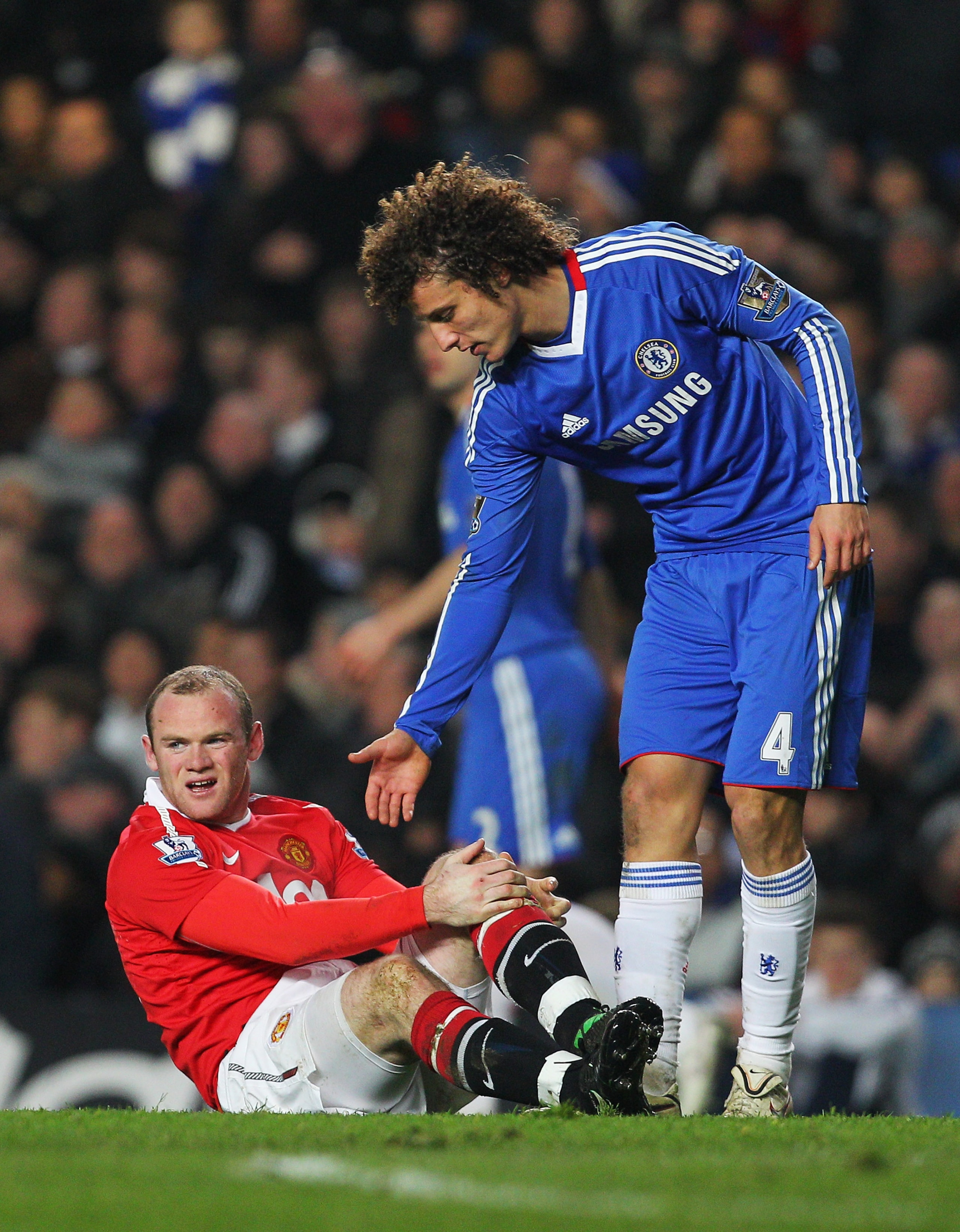LONDON, ENGLAND - MARCH 01: David Luiz of Chelsea offers his hand to Wayne Rooney of Manchester United during the Barclays Premier League match between Chelsea and Manchester United at Stamford Bridge on March 1, 2011 in London, England. (Photo by Clive LONDON, ENGLAND - MARCH 01: David Luiz of Chelsea offers his hand to Wayne Rooney of Manchester United during the Barclays Premier League match between Chelsea and Manchester United at Stamford Bridge on March 1, 2011 in London, England. (Photo by Clive