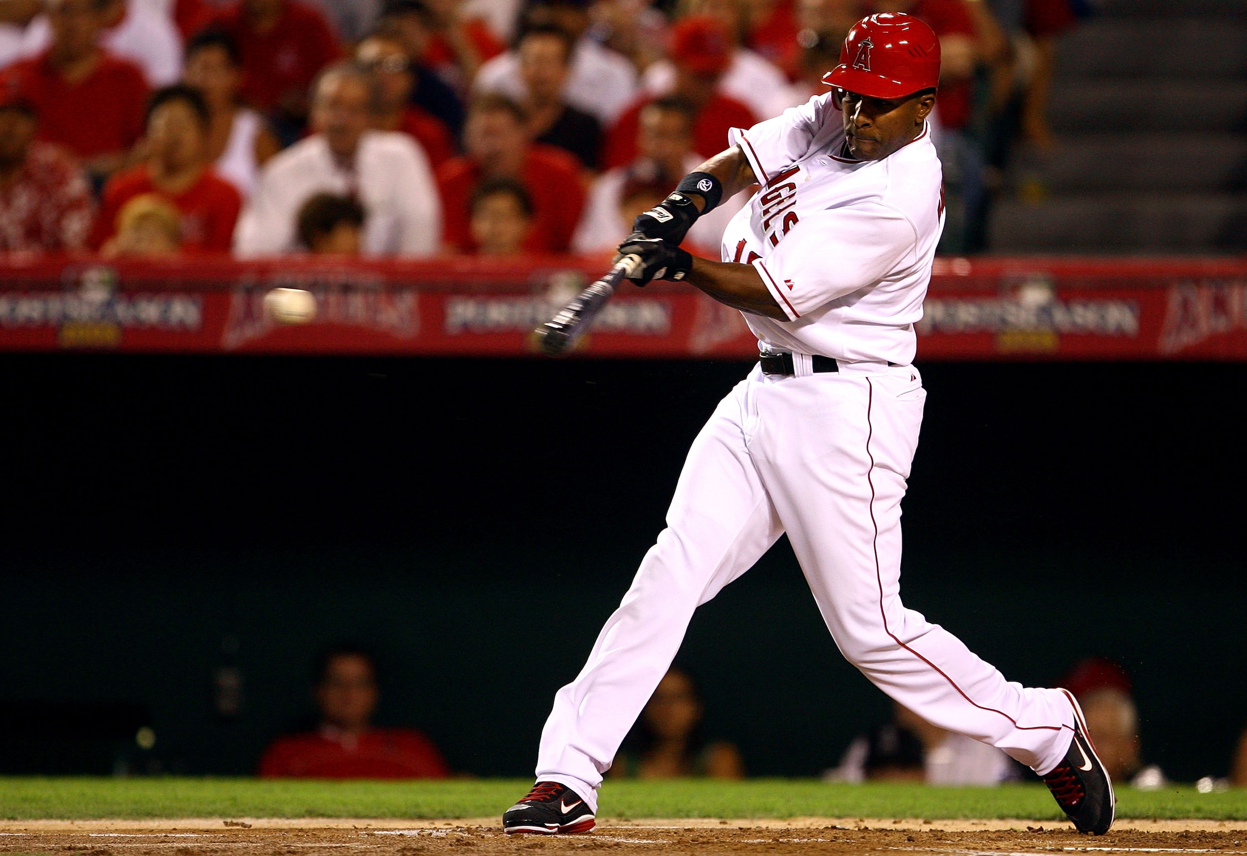ANAHEIM, CA - OCTOBER 01:  Garret Anderson #16 of the Los Angeles Angels of Anaheim hits a single in the first inning against the Boston Red Sox during game one of the American League Division Series at Angel Stadium on October 1, 2008 in Anaheim, Califor