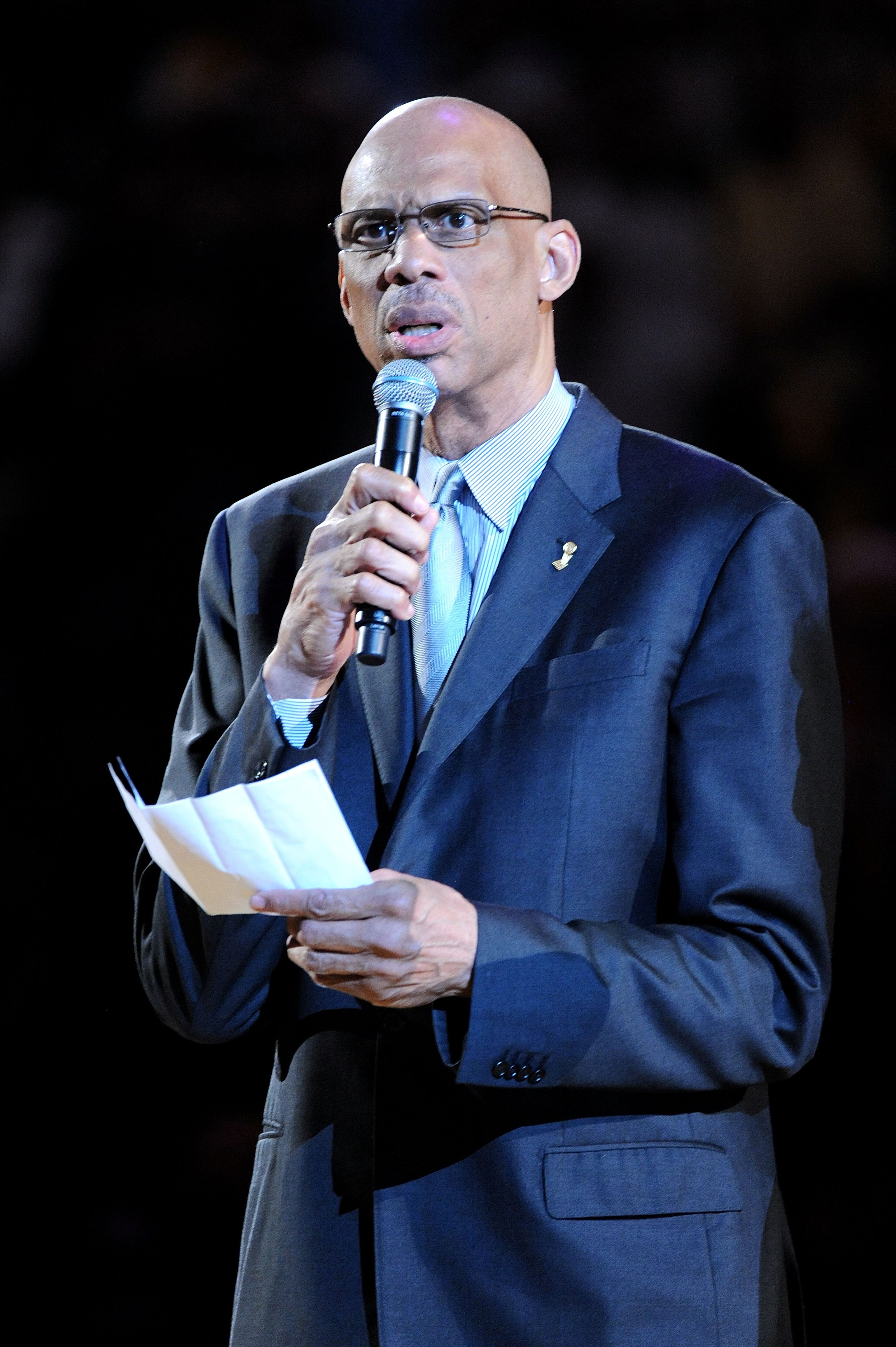 LOS ANGELES, CA - JUNE 06:  NBA Legend Kareem Abdul-Jabbar addresses the fans prior to a moment of silence in memory of the late John Wooden, who coached Walton at UCLA duringhis college career before the Boston Celtics play against the Los Angeles Lakers