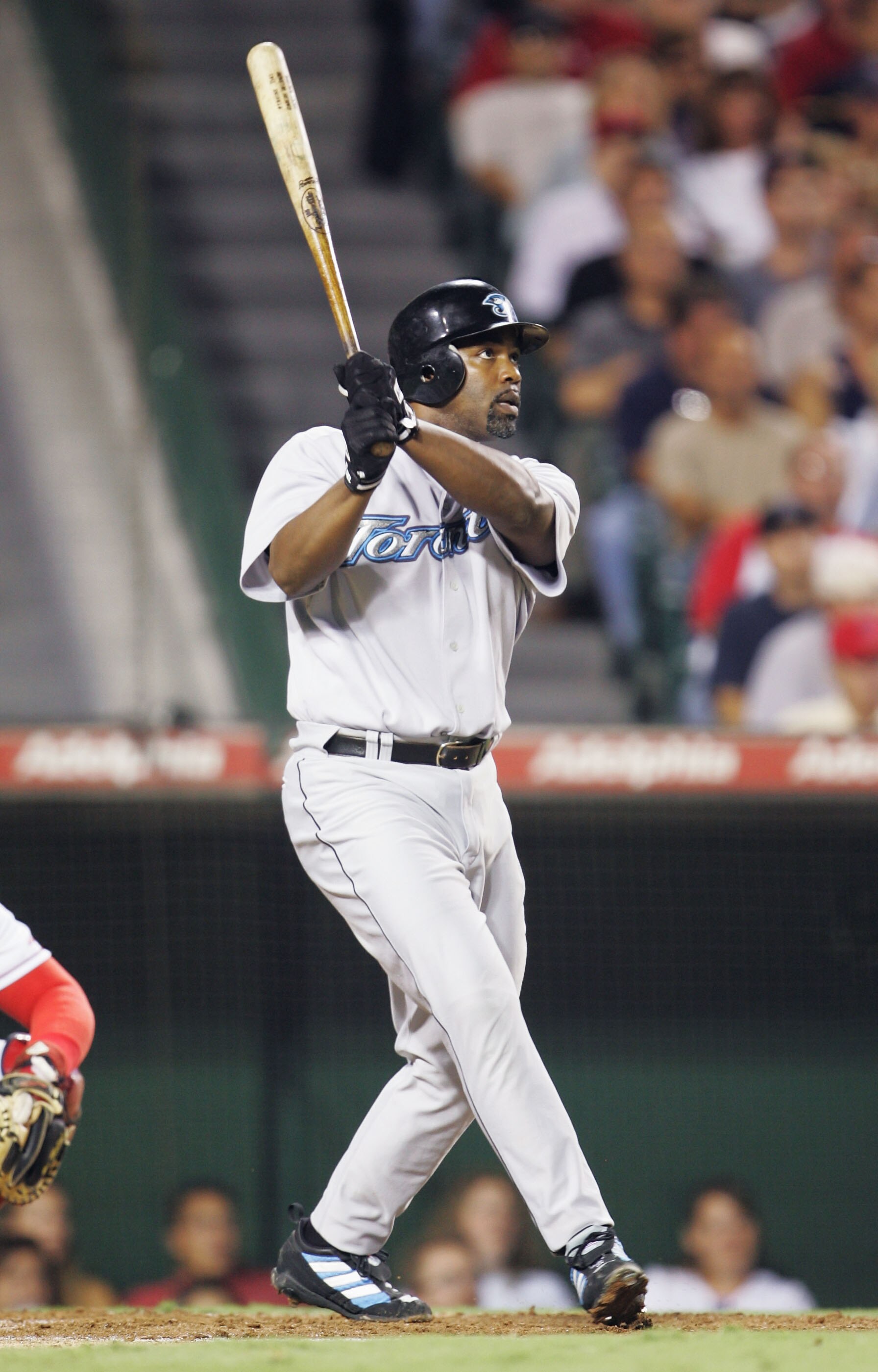 ANAHEIM, CA - SEPTEMBER 9:  Carlos Delgado #25 of the Toronto Blue Jays hits a two-run homerun in the third inning against the Anaheim Angels during the game at Angel Stadium on September 9, 2004 in Anaheim, California. (Photo by Jeff Gross/Getty Images)