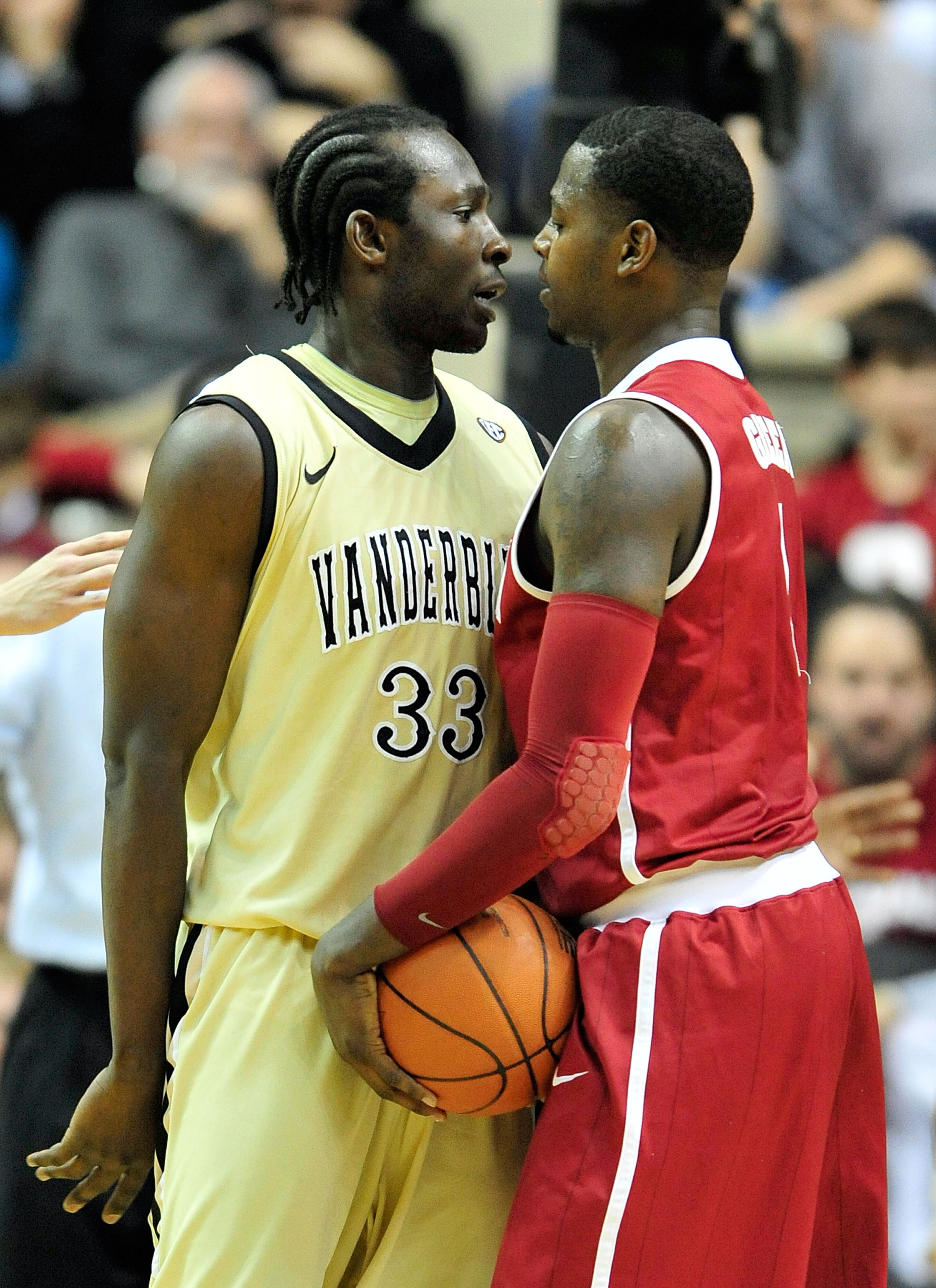 NASHVILLE, TN - FEBRUARY 10:  Steve Tchiengang #33 of the Vanderbilt Commodores and JaMychal Green #1 of the Alabama Crimson Tide exchange words at Memorial Gym on February 10, 2011 in Nashville, Tennessee. Vanderbilt won 81-77. (Photo by Grant Halverson/