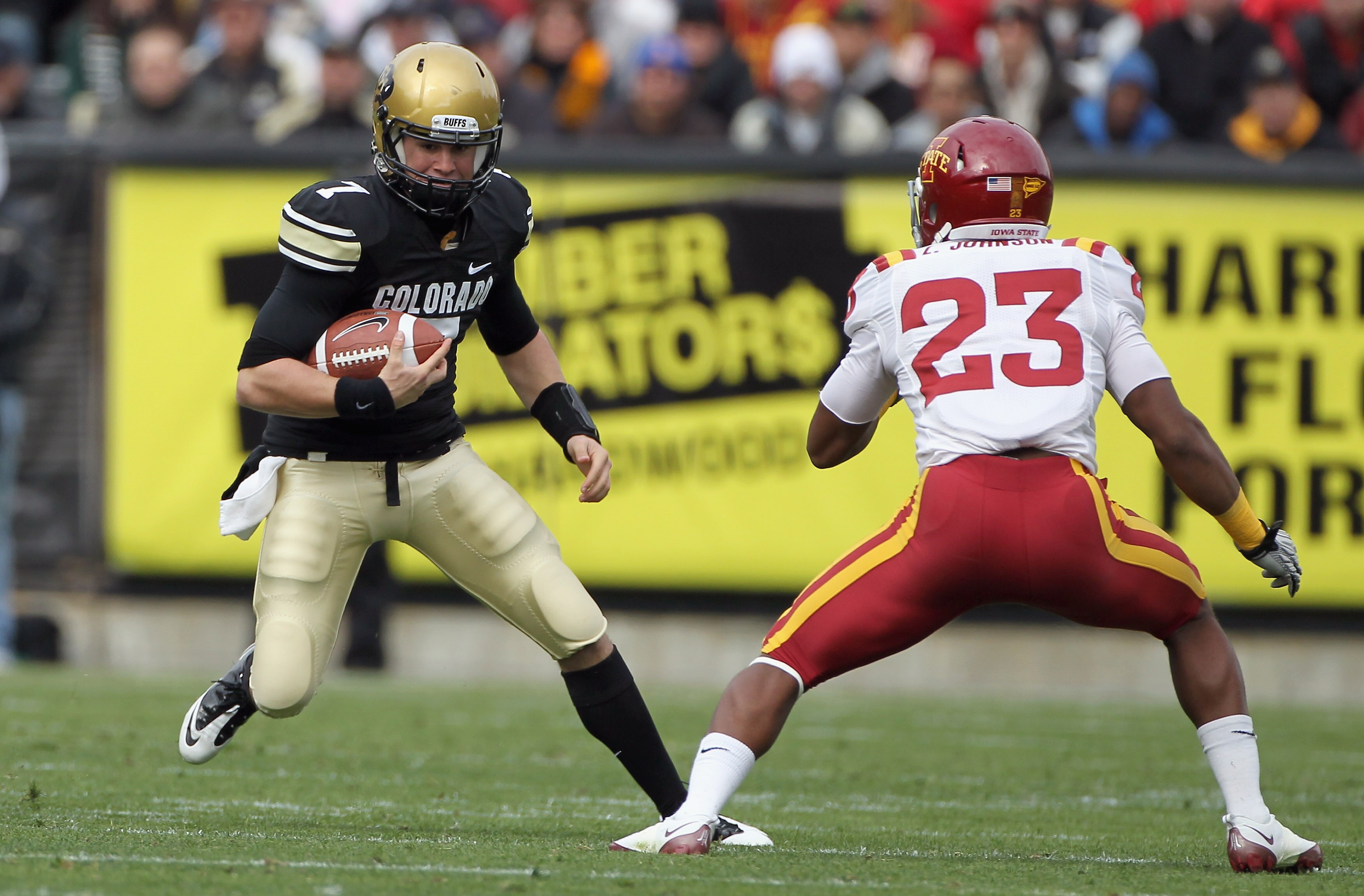 BOULDER, CO - NOVEMBER 13: Quarterback Cody Hawkins #7 of the Colorado Buffaloes scrambles as Leonard Johnson #23 of the Iowa State Cyclones defends at Folsom Field on November 13, 2010 in Boulder, Colorado. Colorado defeated Iowa State 34-14. (Photo by BOULDER, CO - NOVEMBER 13: Quarterback Cody Hawkins #7 of the Colorado Buffaloes scrambles as Leonard Johnson #23 of the Iowa State Cyclones defends at Folsom Field on November 13, 2010 in Boulder, Colorado. Colorado defeated Iowa State 34-14. (Photo by