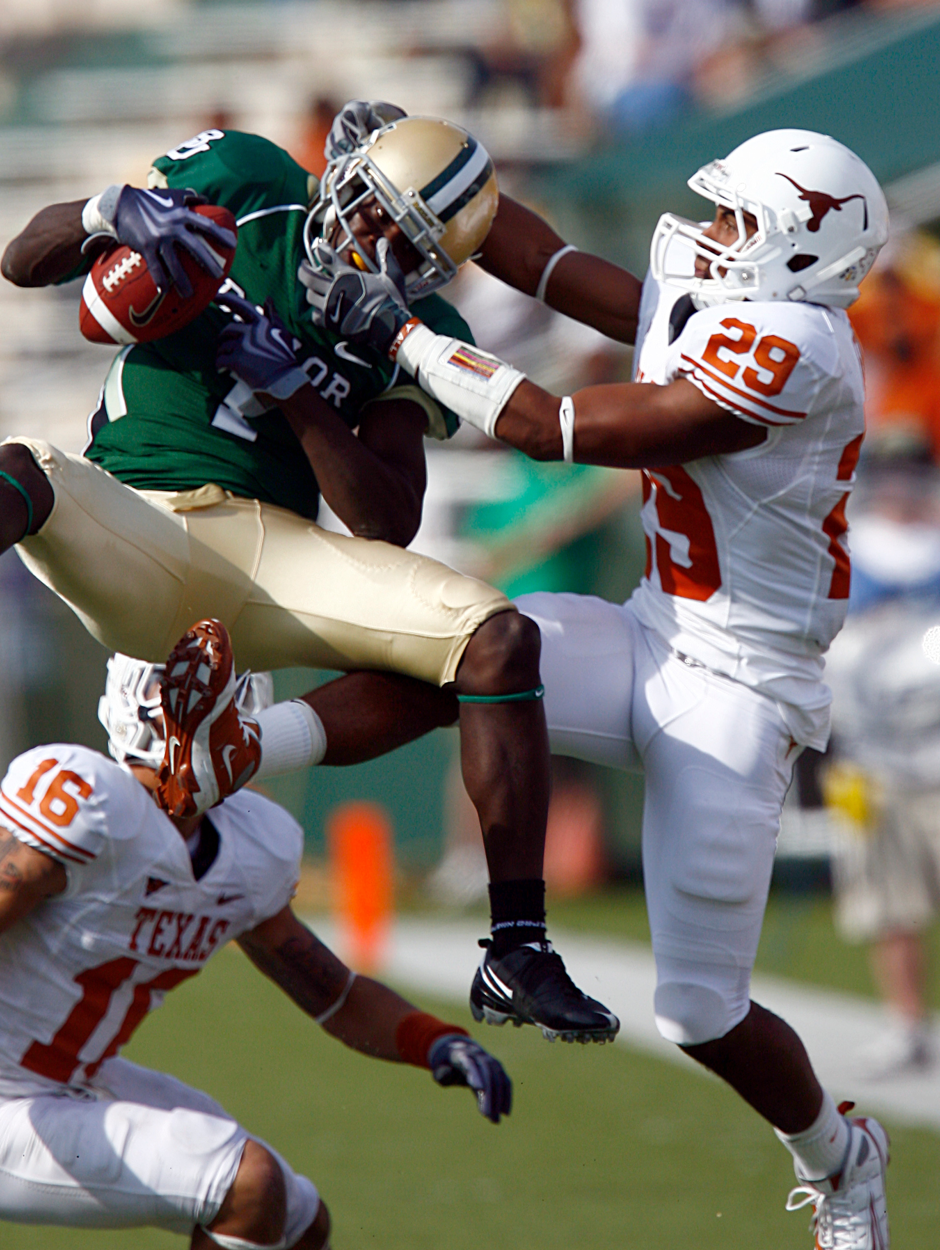 WACO, TX - NOVEMBER 14:  Inside receiver Kendall Wright #1 for the Baylor Bears pull in a pass against defensive back Clark Ford #29 for the Texas Longhorns in the second half on November 14, 2009 at Floyd Casey Stadium in Waco, Texas.  The Longhorns beat