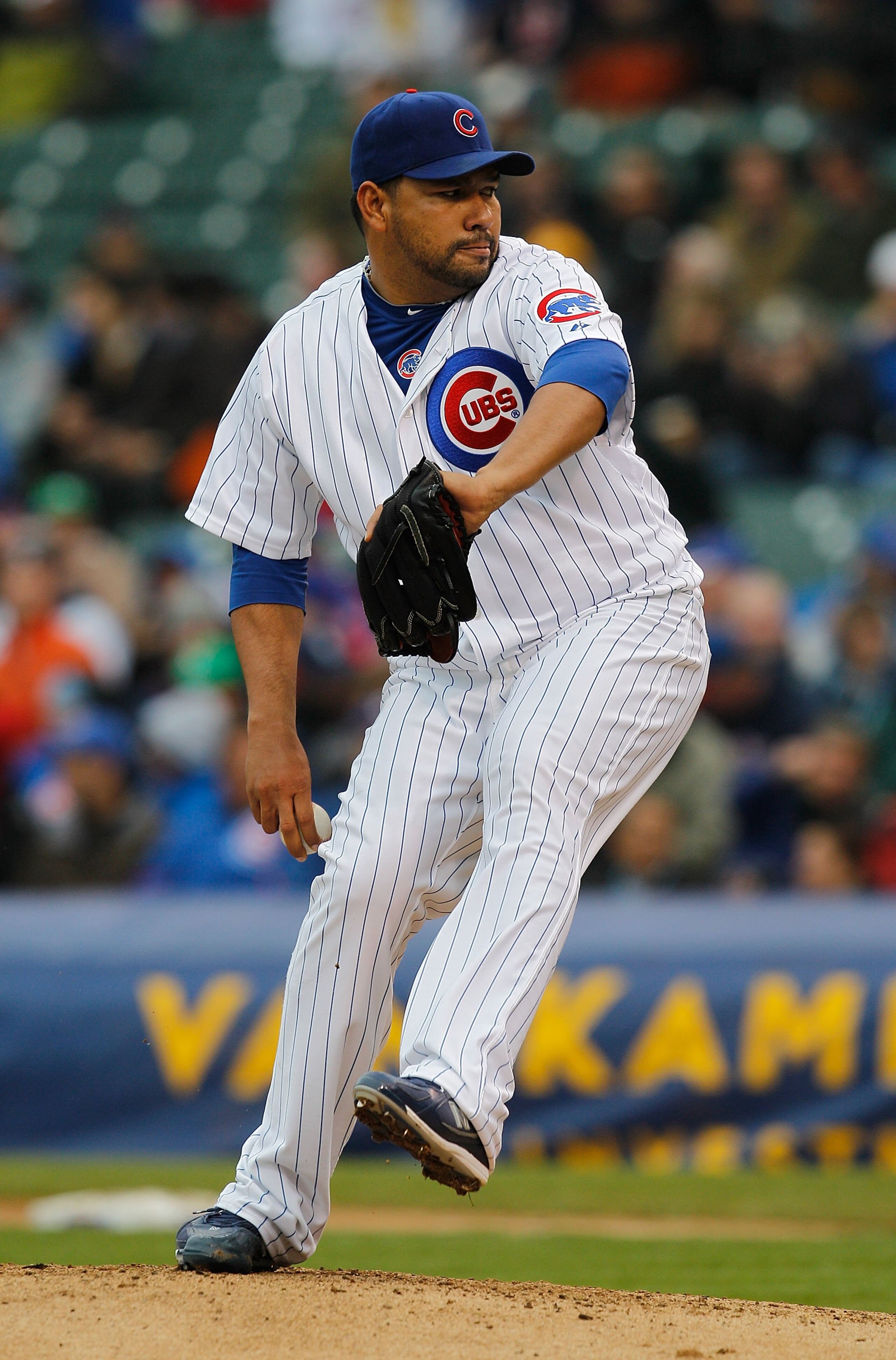 CHICAGO - MAY 12: Starting pitcher Carlos Silva #52 of the Chicago Cubs delivers the ball against the Florida Marlins at Wrigley Field on May 12, 2010 in Chicago, Illinois. The Cubs defeated the Marlins 4-3.  (Photo by Jonathan Daniel/Getty Images)