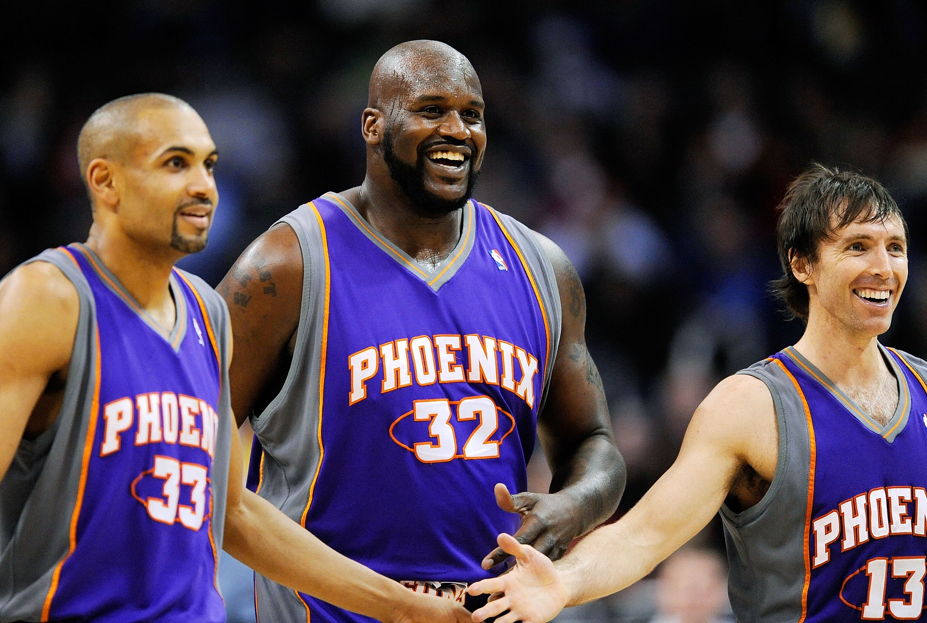 LOS ANGELES, CA - FEBRUARY 18:  Shaquille O'Neal #32 of the Phoenix Suns is congratualted by his teammate Steve Nash #13 and Grant Hill #33 during the basketball game against the Los Angeles Clippers during the second quarter at the Staples Center on Febr