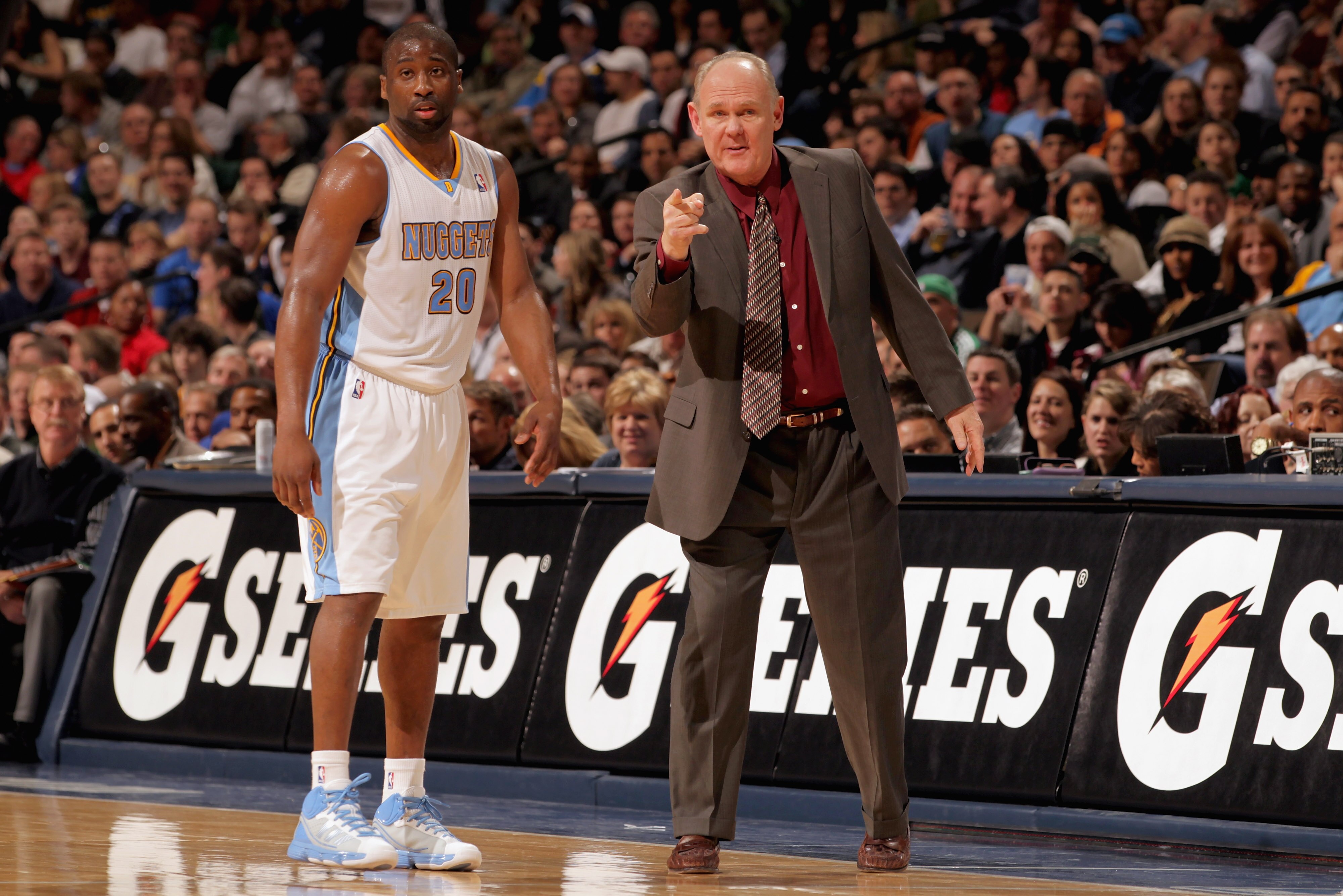 DENVER, CO - FEBRUARY 24:  Head coach George Karl directs Raymond Felton #20 of the Denver Nuggets against the Boston Celtics during NBA action at the Pepsi Center on February 24, 2011 in Denver, Colorado. The Nuggets defeated the Celtics 89-75. NOTE TO U