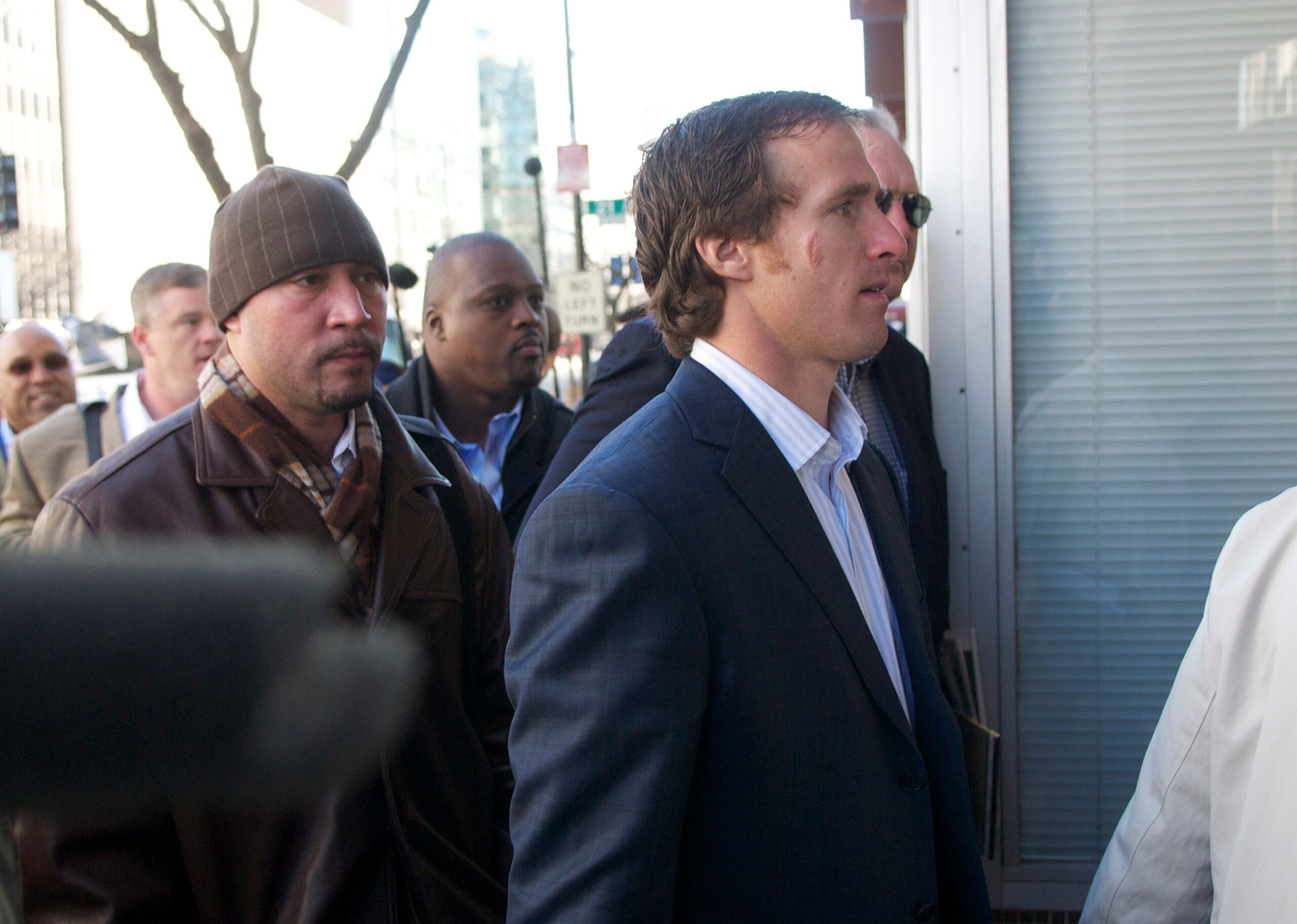 WASHINGTON, DC - MARCH 03: New Orleans Saints' Drew Brees (R), a member of the NFL Players Association executive committee, makes his way into the Federal Mediation and Conciliation Service building for the NFL labor negotiations on March 3, 2011 in Wash WASHINGTON, DC - MARCH 03: New Orleans Saints' Drew Brees (R), a member of the NFL Players Association executive committee, makes his way into the Federal Mediation and Conciliation Service building for the NFL labor negotiations on March 3, 2011 in Wash