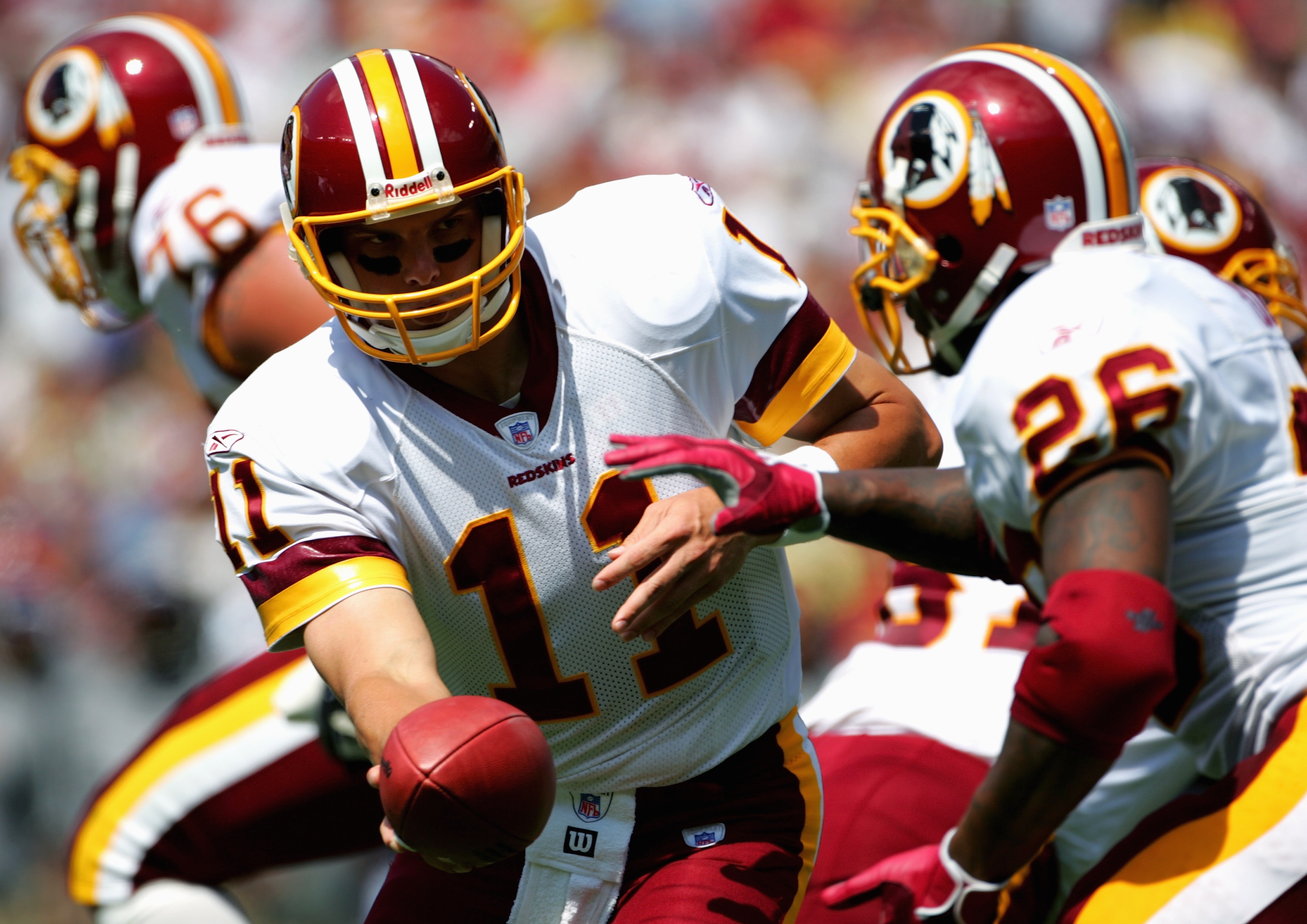LANDOVER, MD - SEPTEMBER 11:  Patrick Ramsey #11 of the Washington Redskins hands off to Clinton Portis #26 during the game with the Chicago Bears on September 11, 2005 at Fed Ex Field in Landover, Maryland.  The Redskins won 9-7. (Photo By Jamie Squire/G