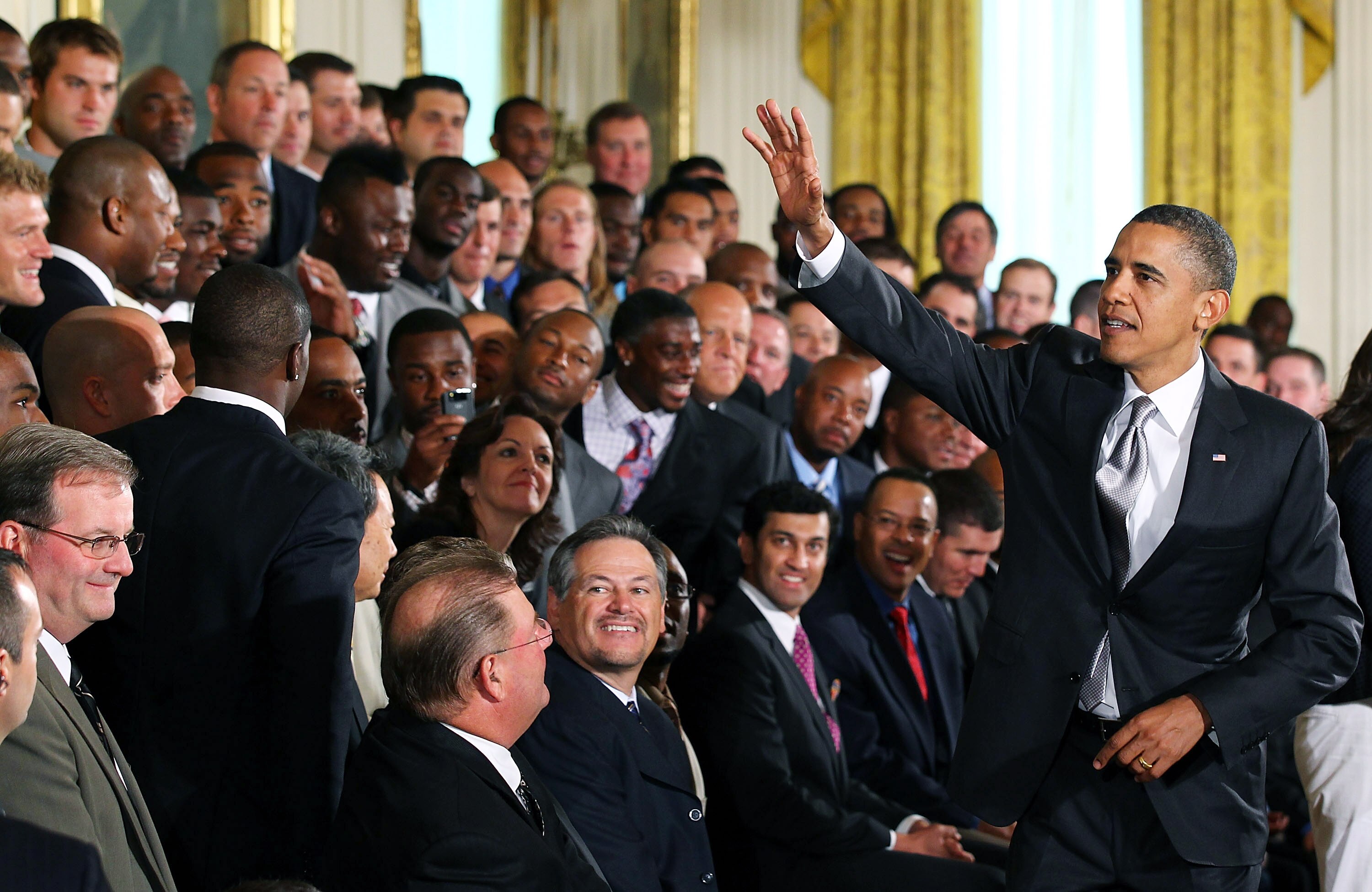 WASHINGTON - AUGUST 09:  U.S. President Barack Obama (R) greets members of the New Orleans Saints during a reception for the 2010 National Football League Super Bowl champions in the East Room of the White House August 9, 2010 in Washington, DC. The Saint