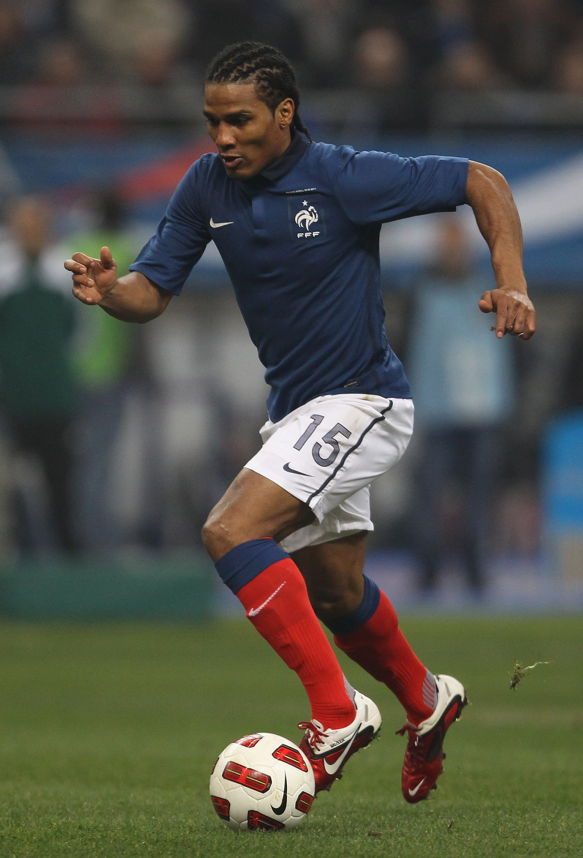 PARIS, FRANCE - FEBRUARY 09:  Florent Malouda of France runs with the ball during the International friendly match between France and Brazil at Stade de France on February 9, 2011 in Paris, France.  (Photo by Alex Livesey/Getty Images)