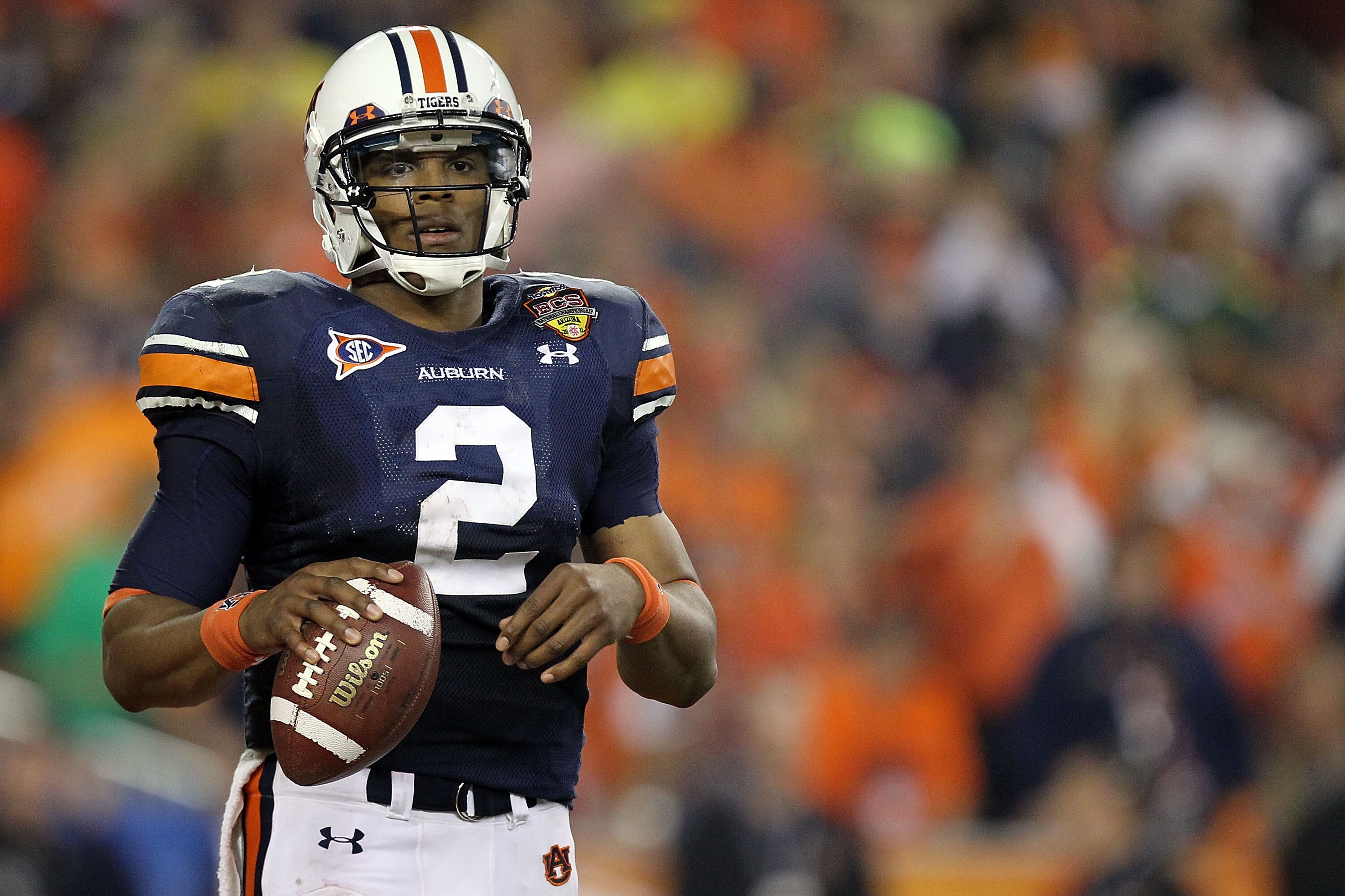 GLENDALE, AZ - JANUARY 10:  Quarterback Cameron Newton #2 of the Auburn Tigers holds the ball in the second quarter against the Oregon Ducks during the Tostitos BCS National Championship Game at University of Phoenix Stadium on January 10, 2011 in Glendal