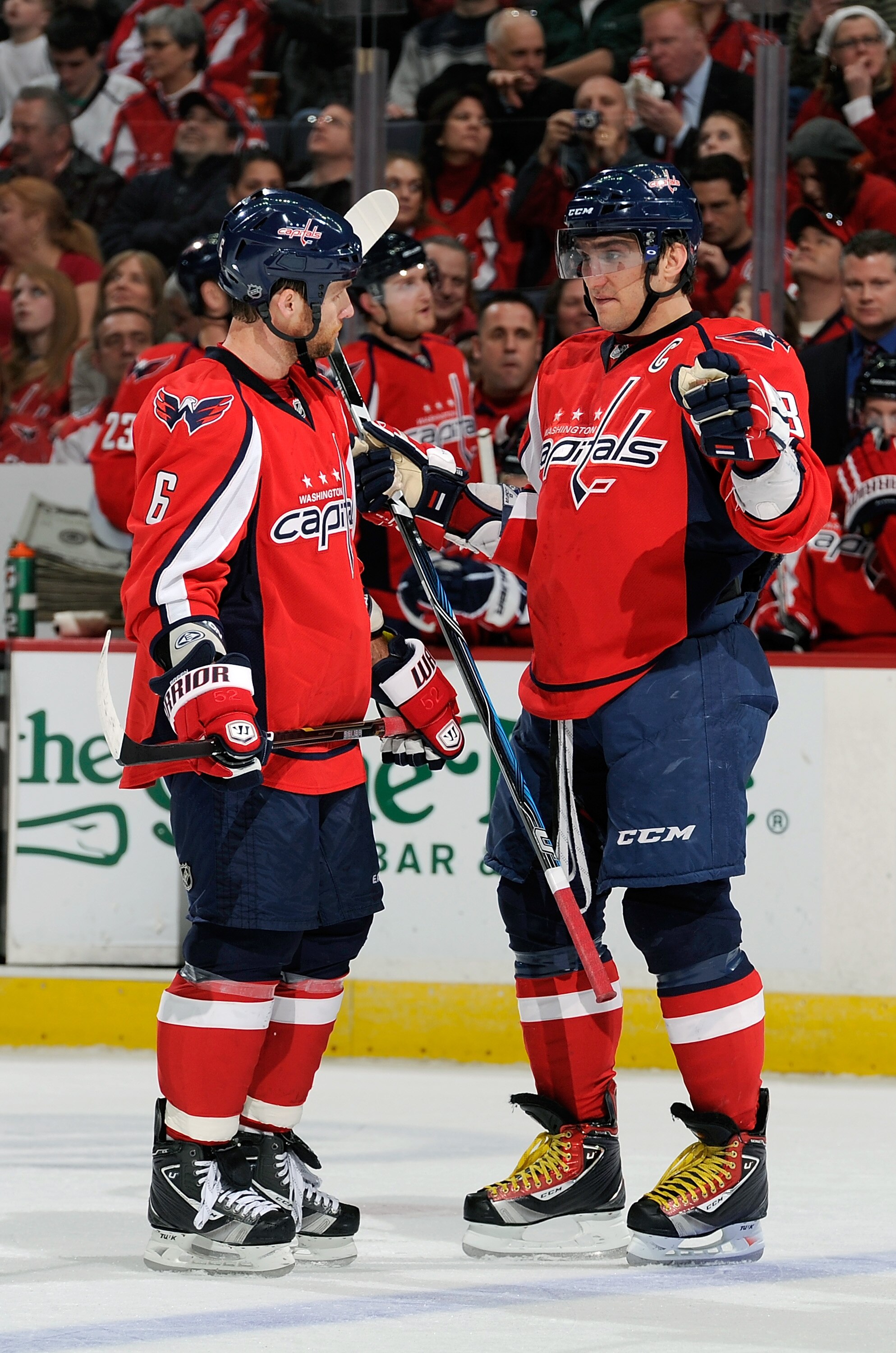 WASHINGTON, DC - MARCH 01:  Dennis Wideman #6 and Alex Ovechkin #8 of the Washington Capitals talk during the game against the New York Islanders at the Verizon Center on March 1, 2011 in Washington, DC.  (Photo by Greg Fiume/Getty Images)