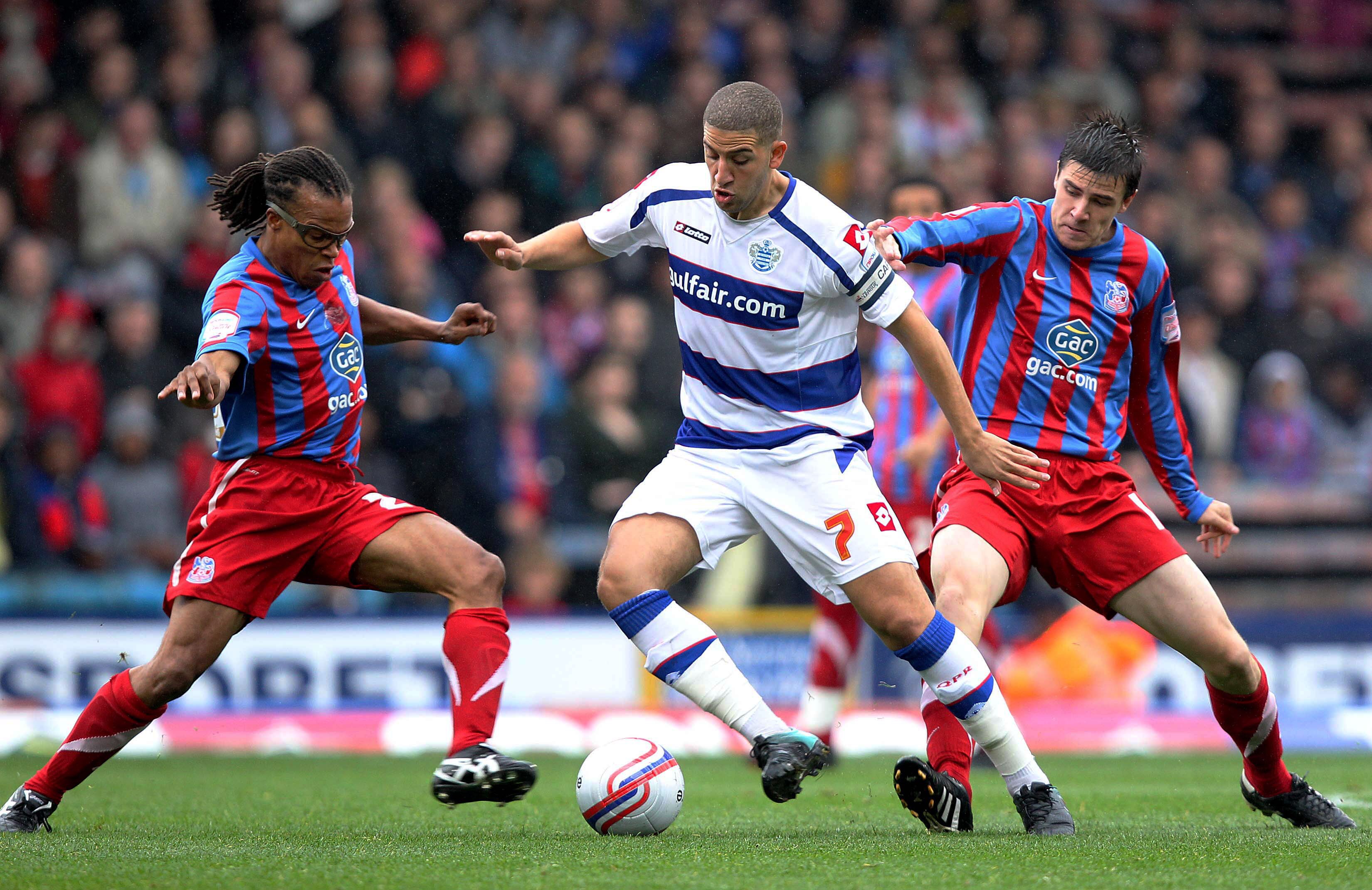 LONDON, ENGLAND - OCTOBER 2 :   Edgar Davids of Crystal Palace wins the ball from Adel Taarabt of Queens Park Rangers during the npower Championship match between Crystal Palace and Queens Park Rangers at Selhurst Park on October 2, 2010 in London, Englan