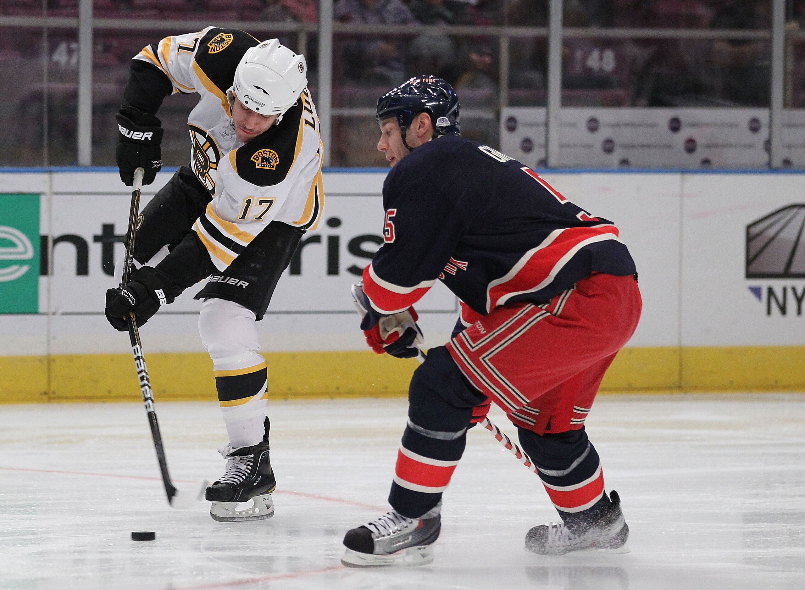 NEW YORK - NOVEMBER 17:  Milan Lucic #17 of the Boston Bruins in action against Dan Girardi #5 of the New York Rangers during their game on November 17, 2010 at Madison Square Garden in New York City, New York.  (Photo by Al Bello/Getty Images)