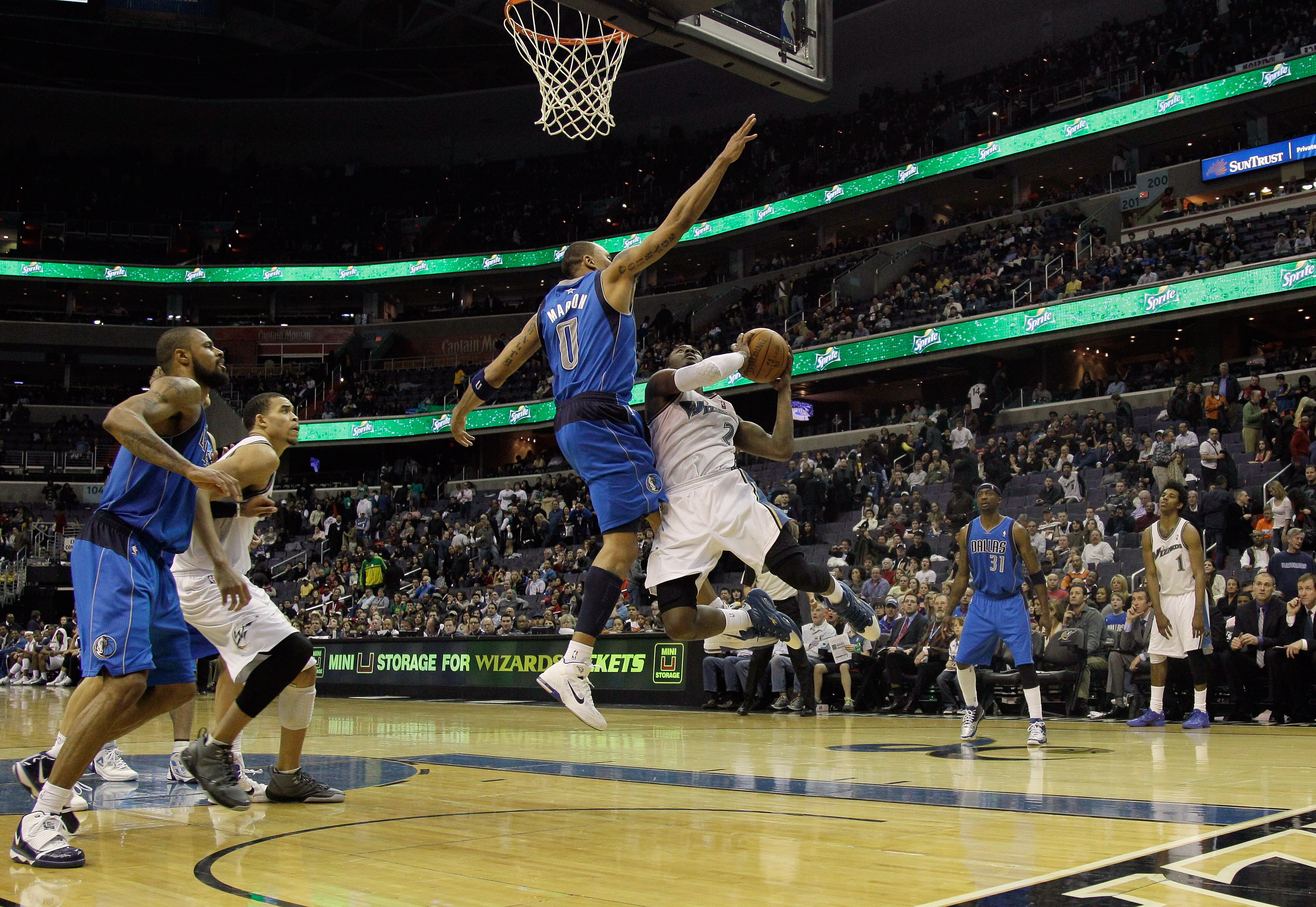 WASHINGTON, DC - FEBRUARY 26: Shawn Marion #0 of the Dallas Mavericks blocks a shot by John Wall #2 of the Washington Wizards at the Verizon Center on February 26, 2011 in Washington, DC. NOTE TO USER: User expressly acknowledges and agrees that, by downl