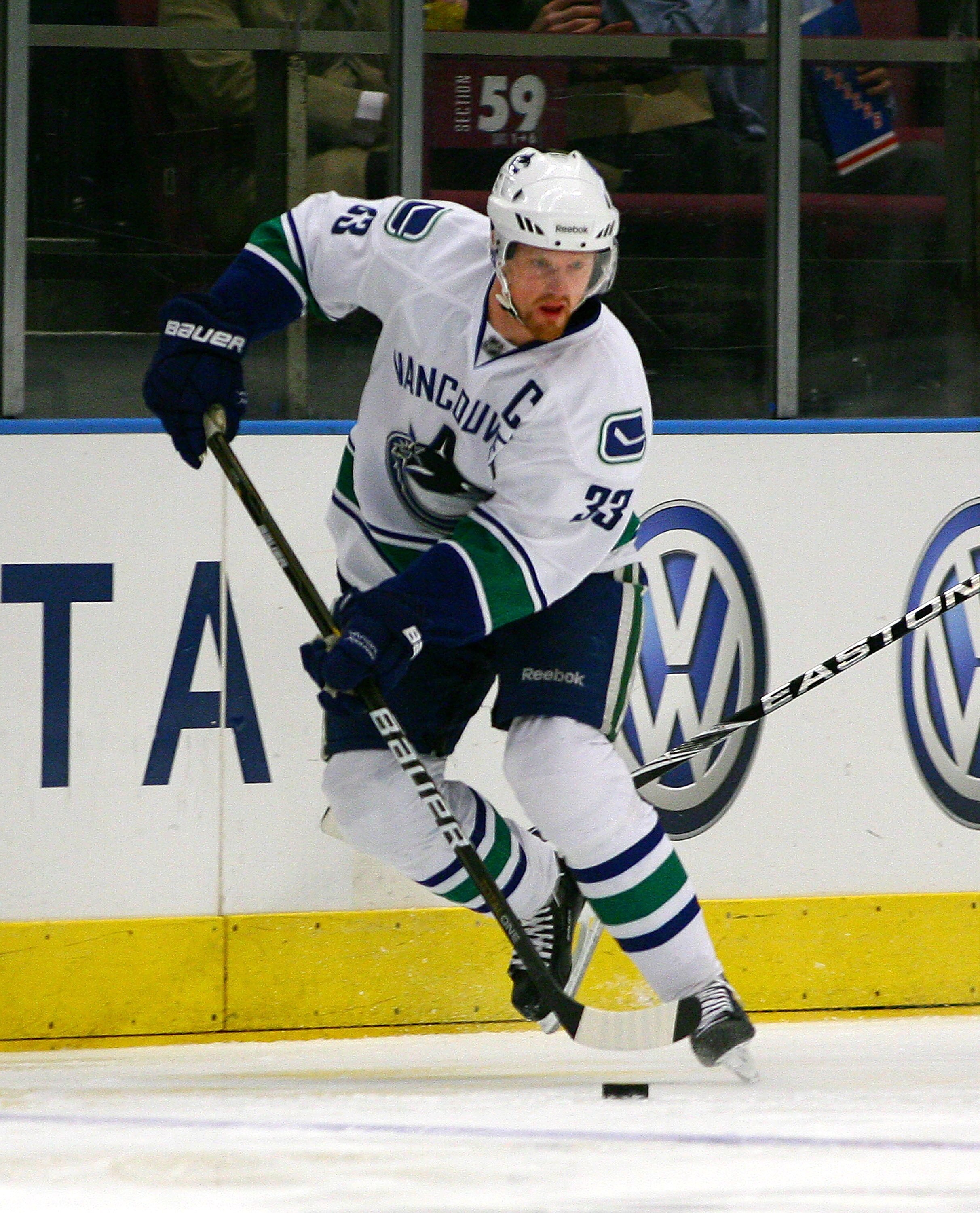 NEW YORK , NY - JANUARY 13: Henrik Sedin #33 of the Vancouver Canucks plays the puck against the New York Rangers during the game at Madison Square Garden on January 13, 2011 in New York City.  (Photo by Andy Marlin/Getty Images)