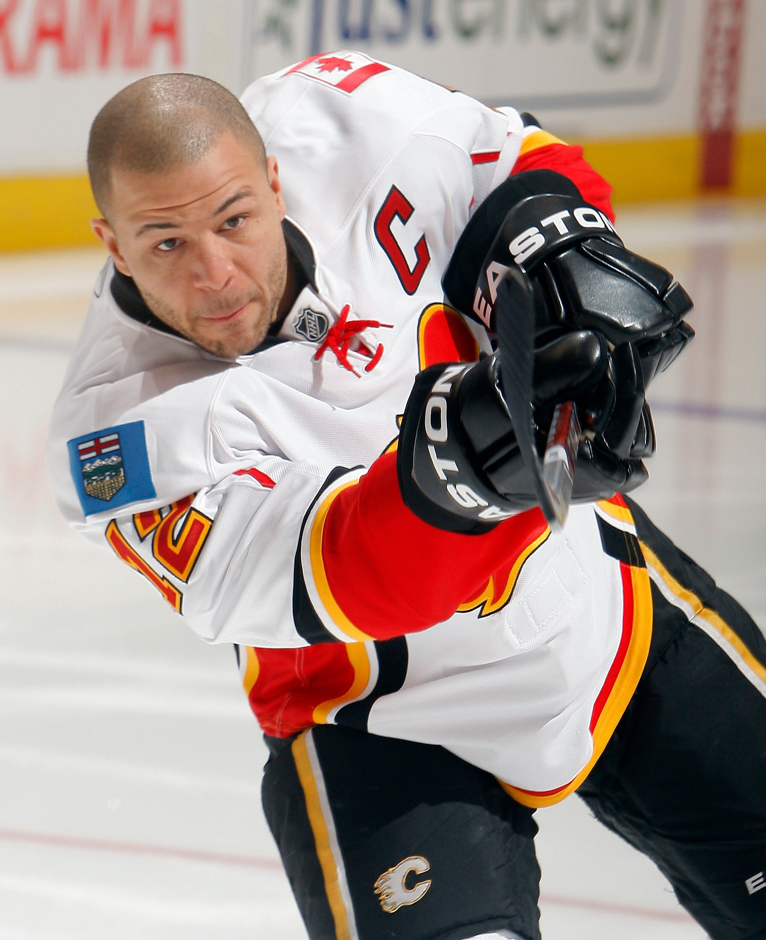 TORONTO, CANADA - JANUARY 15:  Jarome Iginla #12 of the Calgary Flames shoots during warmup before game action against the Toronto Maple Leafs at the Air Canada Centre January 15, 2011 in Toronto, Ontario, Canada. (Photo by Abelimages/Getty Images)