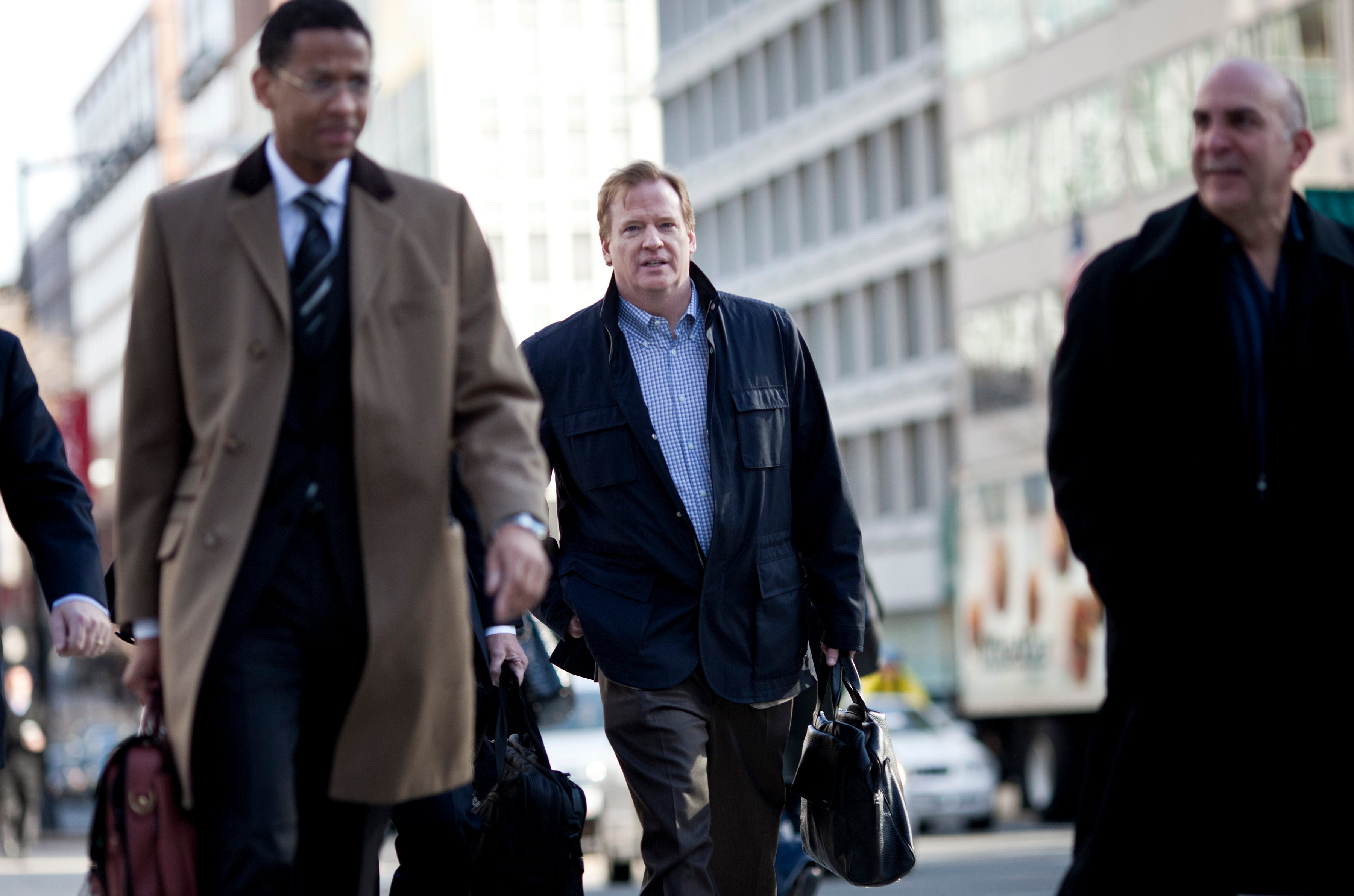 WASHINGTON - MARCH 4: NFL Commissioner Roger Goodell (C) and others arrives for an extra day of negotiations at the Federal Mediation and Conciliation Service building March 4, 2011 in Washington, DC.  Representatives from the National Football League (NF