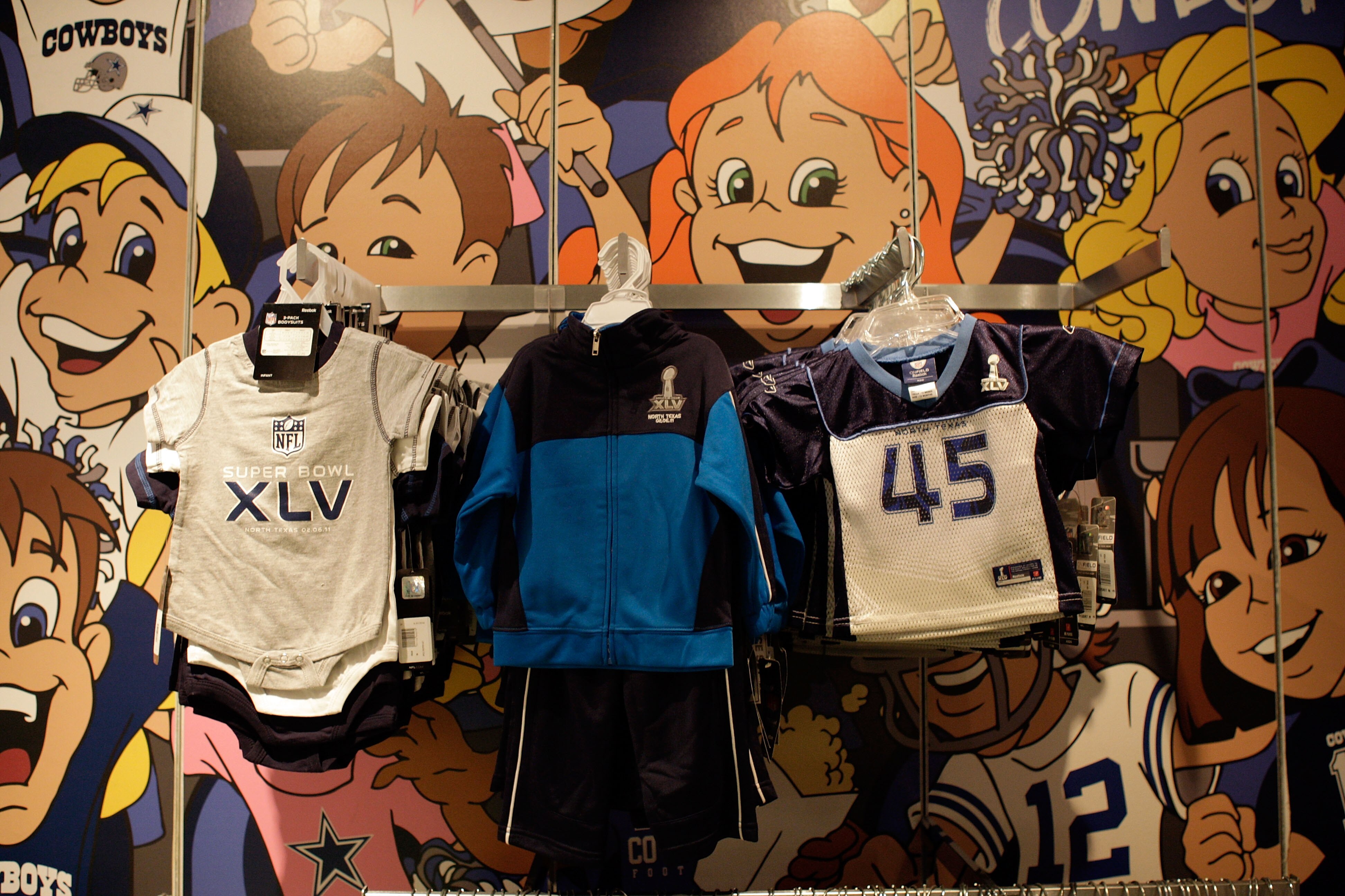 ARLINGTON, TX - FEBRUARY 06:  Clothes for sale with the Super Bowl XLV logo are displayed inside the Pro Shop at Cowboys Stadium before Super Bowl XLV on February 6, 2011 in Arlington, Texas.  (Photo by Jamie Squire/Getty Images)