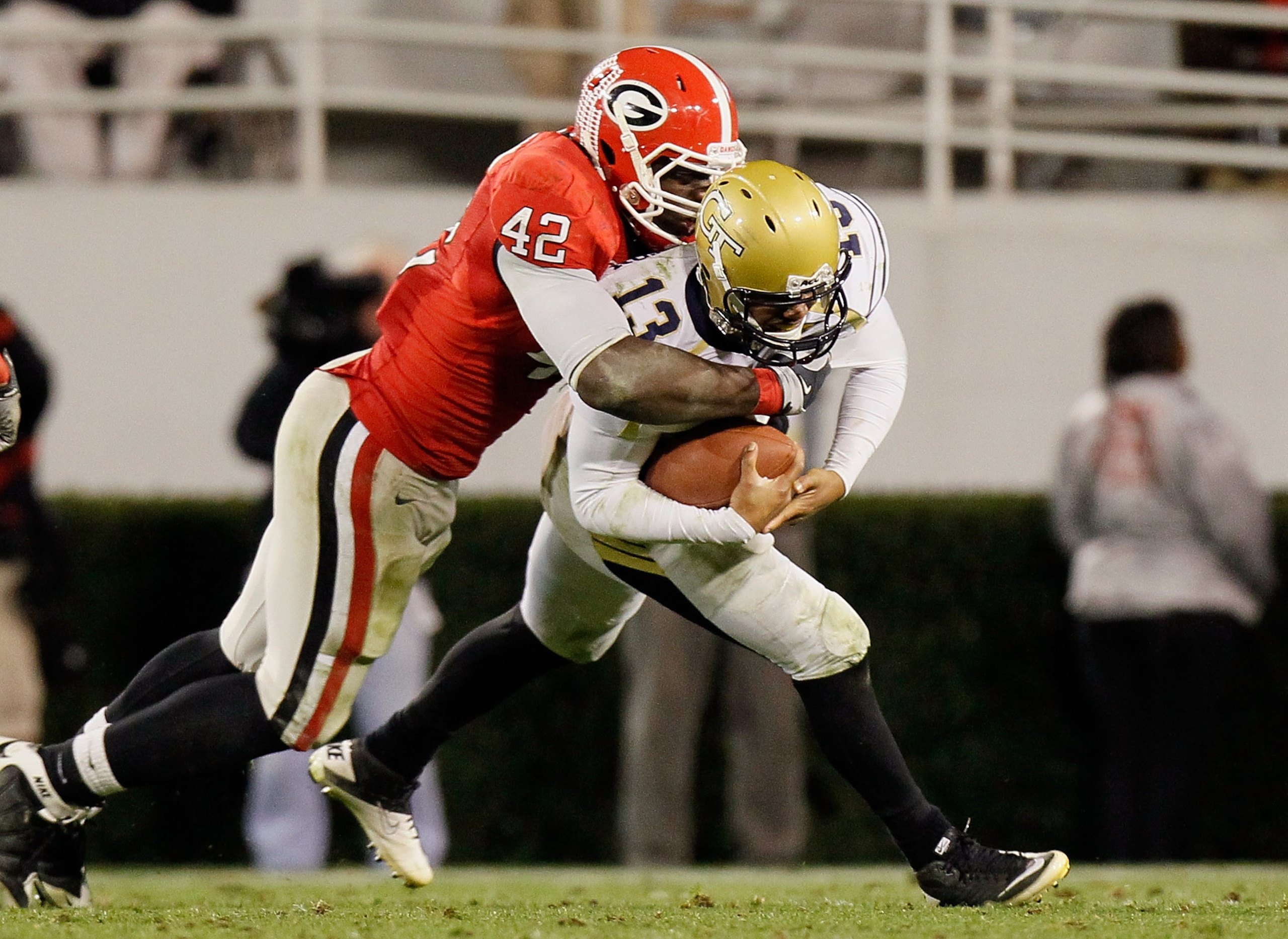ATHENS, GA - NOVEMBER 27: Justin Houston #42 of the Georgia Bulldogs sacks quarterback Tevin Washington #13 of the Georgia Tech Yellow Jackets at Sanford Stadium on November 27, 2010 in Athens, Georgia. (Photo by Kevin C. Cox/Getty Images) ATHENS, GA - NOVEMBER 27: Justin Houston #42 of the Georgia Bulldogs sacks quarterback Tevin Washington #13 of the Georgia Tech Yellow Jackets at Sanford Stadium on November 27, 2010 in Athens, Georgia. (Photo by Kevin C. Cox/Getty Images)