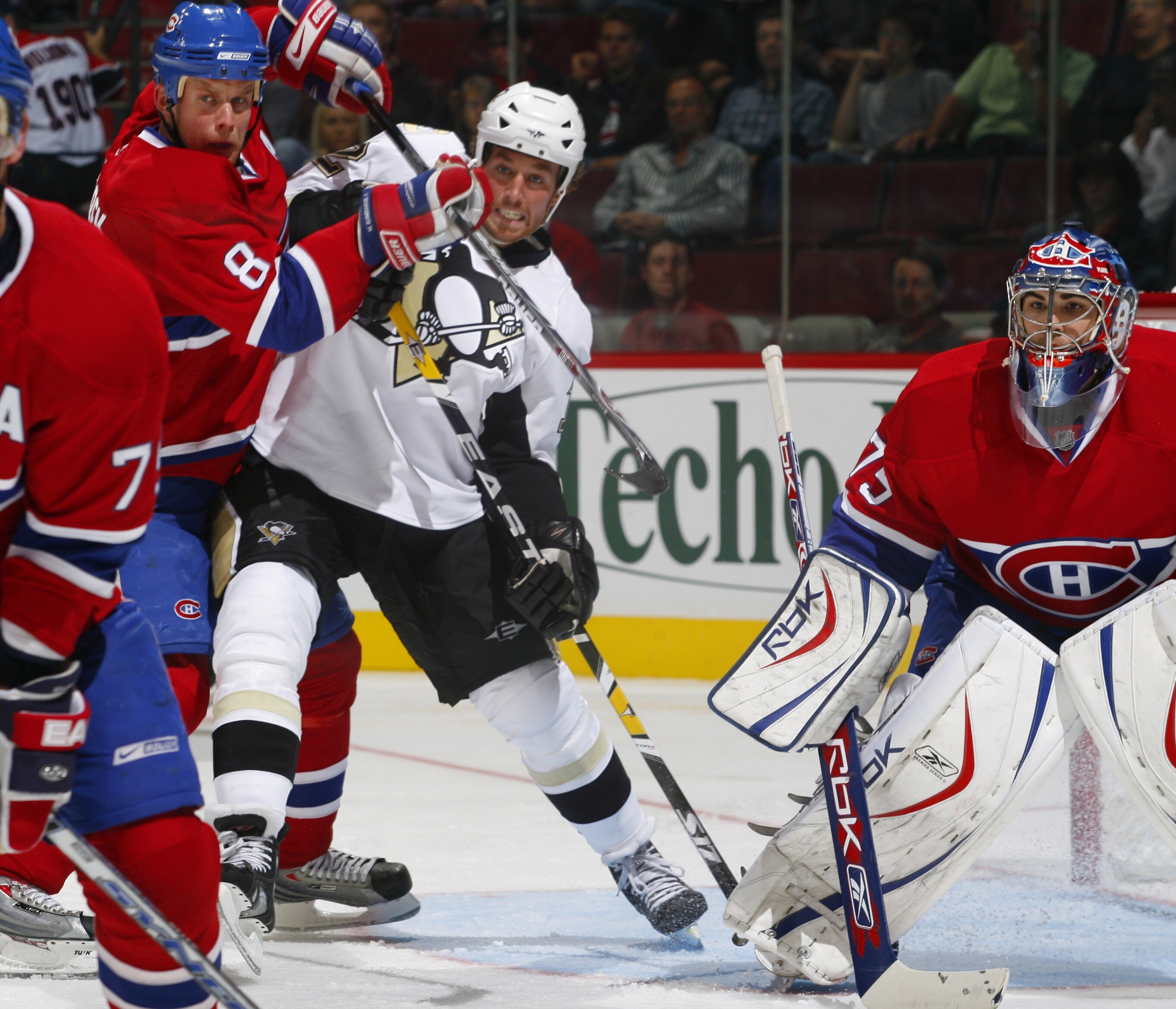 MONTREAL, CANADA - SEPTEMBER 17: Ryan Malone #12 of the Pittsburgh Penguins fights for position with Michael Komisarek #8 of the Montreal Canadiens out front of his goaltender Yann Danis #75 during a pre-season game on September 17, 2007 at the Bell Cent MONTREAL, CANADA - SEPTEMBER 17: Ryan Malone #12 of the Pittsburgh Penguins fights for position with Michael Komisarek #8 of the Montreal Canadiens out front of his goaltender Yann Danis #75 during a pre-season game on September 17, 2007 at the Bell Cent