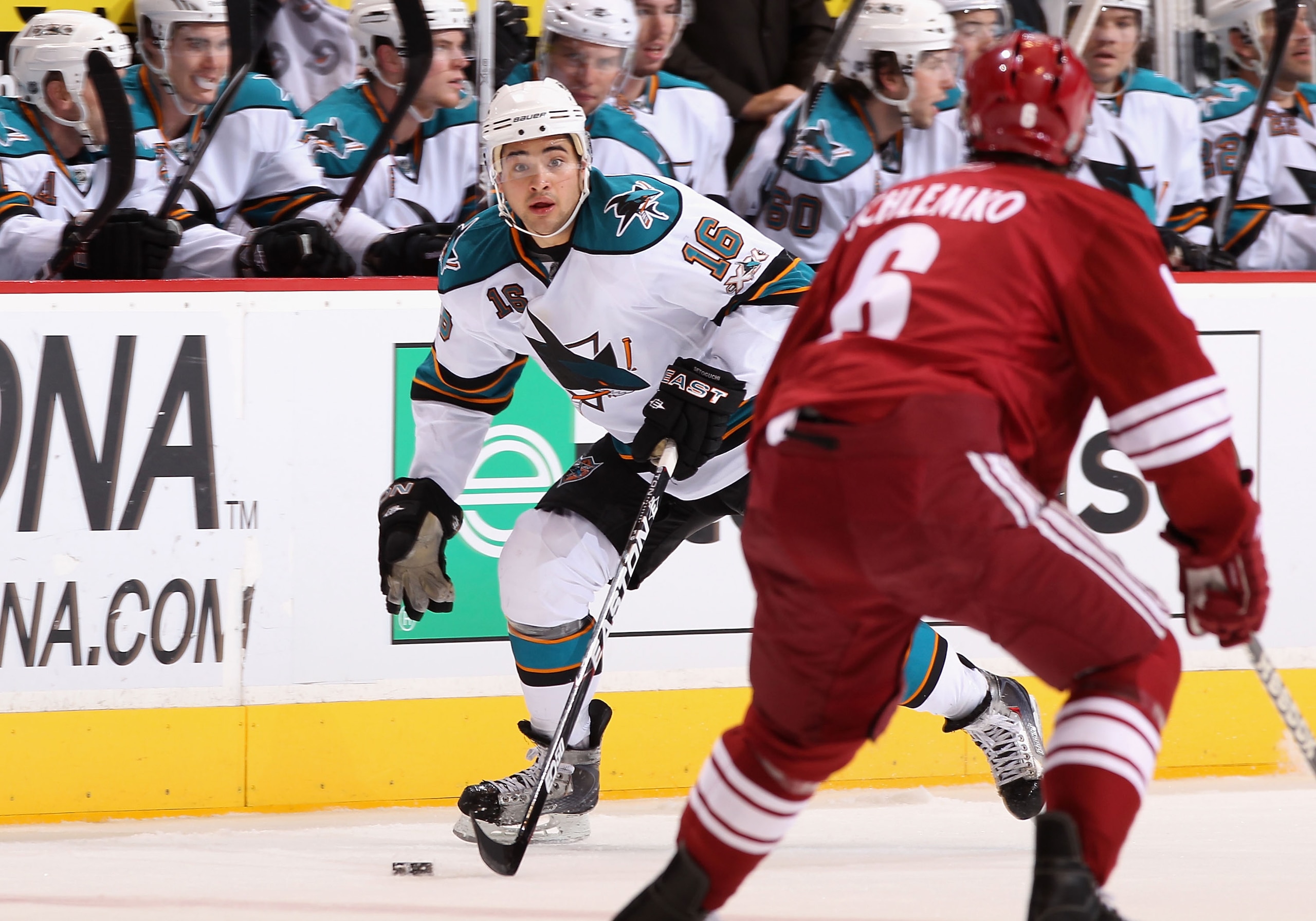 GLENDALE, AZ - JANUARY 17:  Devin Setoguchi #16 of the San Jose Sharks skates with the puck during the NHL game against the Phoenix Coyotes at Jobing.com Arena on January 17, 2011 in Glendale, Arizona.  The Sharks defeated the Coyotes 4-2.  (Photo by Chri