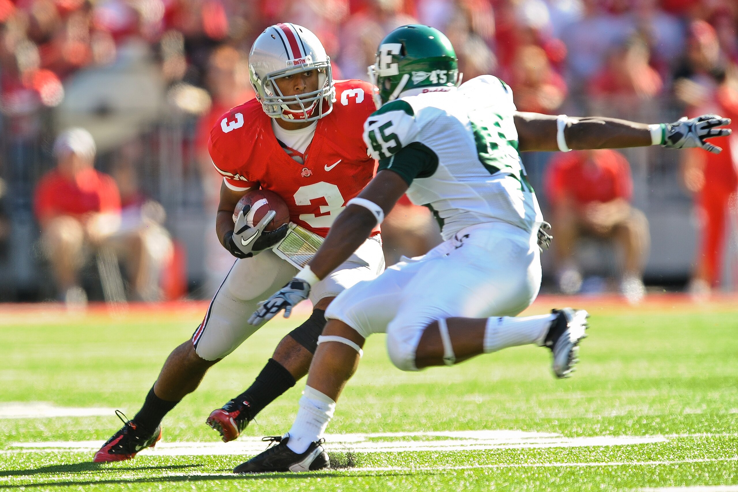 COLUMBUS, OH - SEPTEMBER 25:  Brandon Saine #3 of the Ohio State Buckeyes runs with the ball against Matt Boyd #45 of the Eastern Michigan Eagles at Ohio Stadium on September 25, 2010 in Columbus, Ohio.  Ohio State won 73-20. (Photo by Jamie Sabau/Getty I