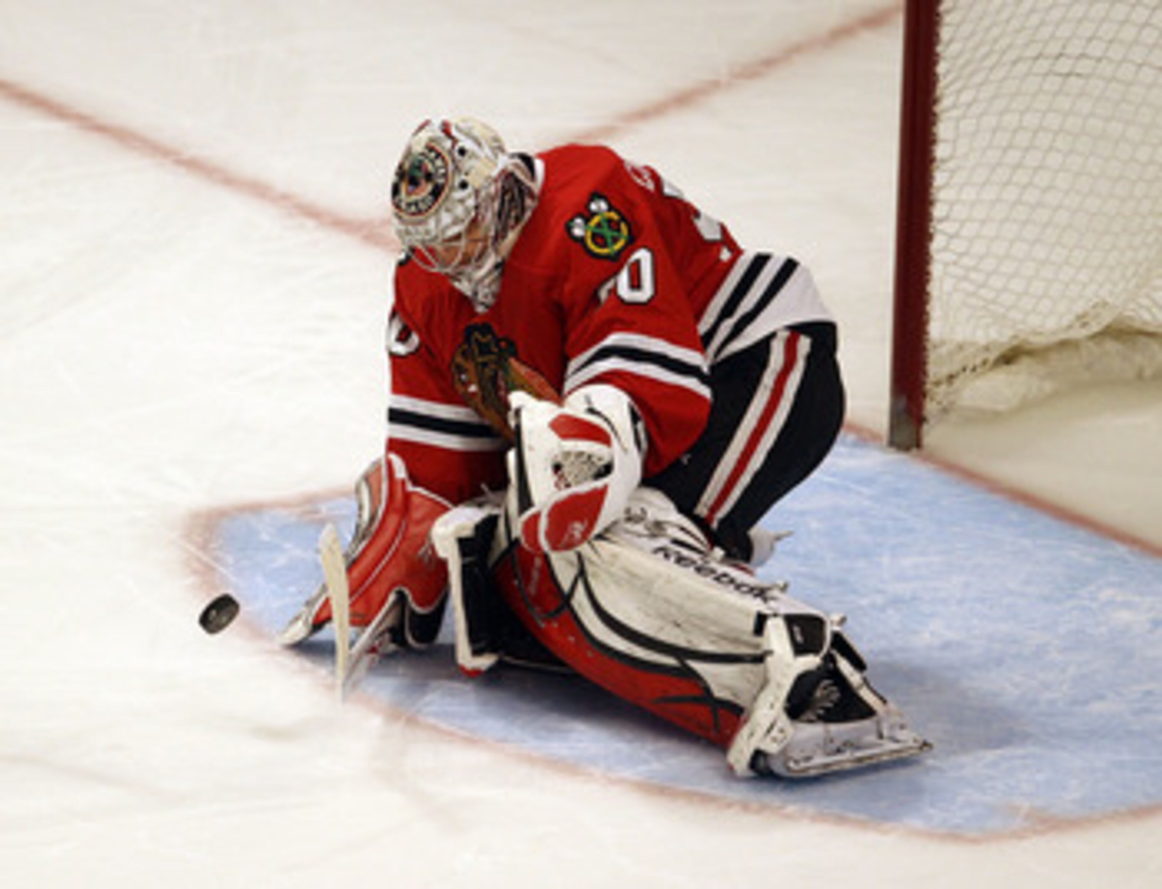 CHICAGO, IL - FEBRUARY 27: Corey Crawford #50 of the Chicago Blackhawks makes a save in the shootout against the Phoenix Coyotes at the United Center on February 27, 2011 in Chicago, Illinois. The Blackhawks defeated the Coyotes 4-3 in a shootout.  (Photo