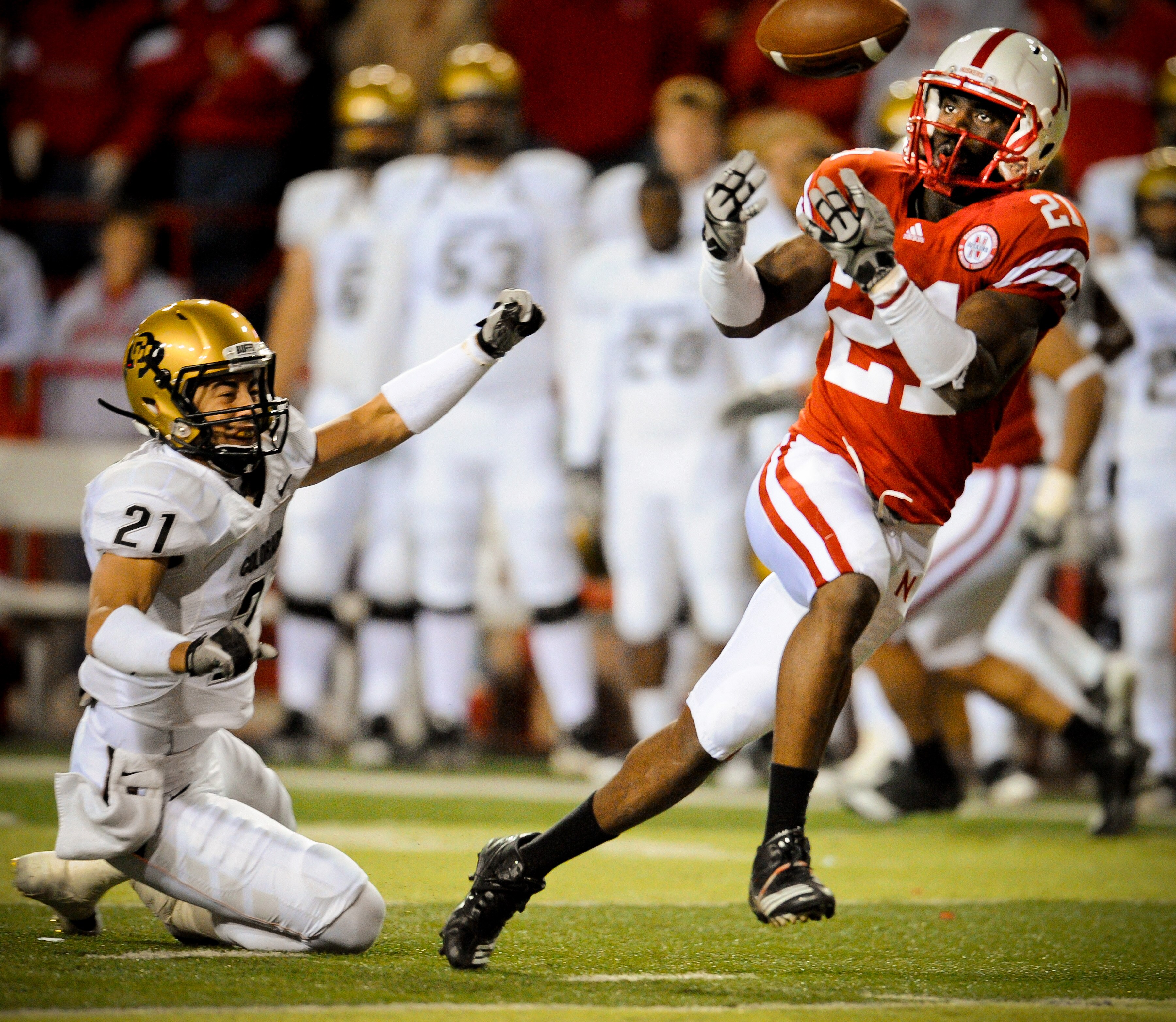 LINCOLN, NE - NOVEMBER 26: Prince Amukamara #21 of the Nebraska Cornhuskers misses a chance at an interception from Scotty McKnight #21 of the Colorado Buffaloes during the second half of their game at Memorial Stadium on November 26, 2010 in Lincoln, Neb LINCOLN, NE - NOVEMBER 26: Prince Amukamara #21 of the Nebraska Cornhuskers misses a chance at an interception from Scotty McKnight #21 of the Colorado Buffaloes during the second half of their game at Memorial Stadium on November 26, 2010 in Lincoln, Neb