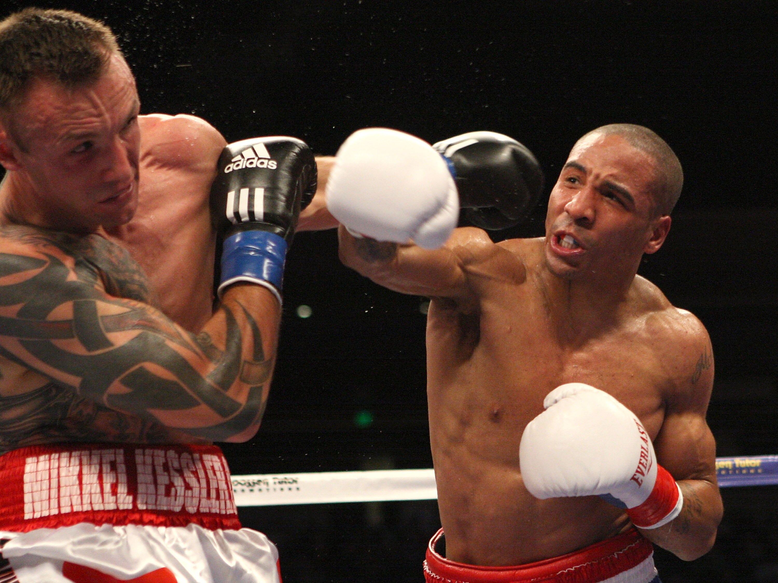 OAKLAND, CA - NOVEMBER 21:  Mikkel Kessler of Denmark (L) is hit by Andre Ward during their WBA Super Middleweight Championship Bout at the Oakland-Alameda County Coliseum on November 21, 2009 in Oakland, California.  (Photo by Jed Jacobsohn/Getty Images)