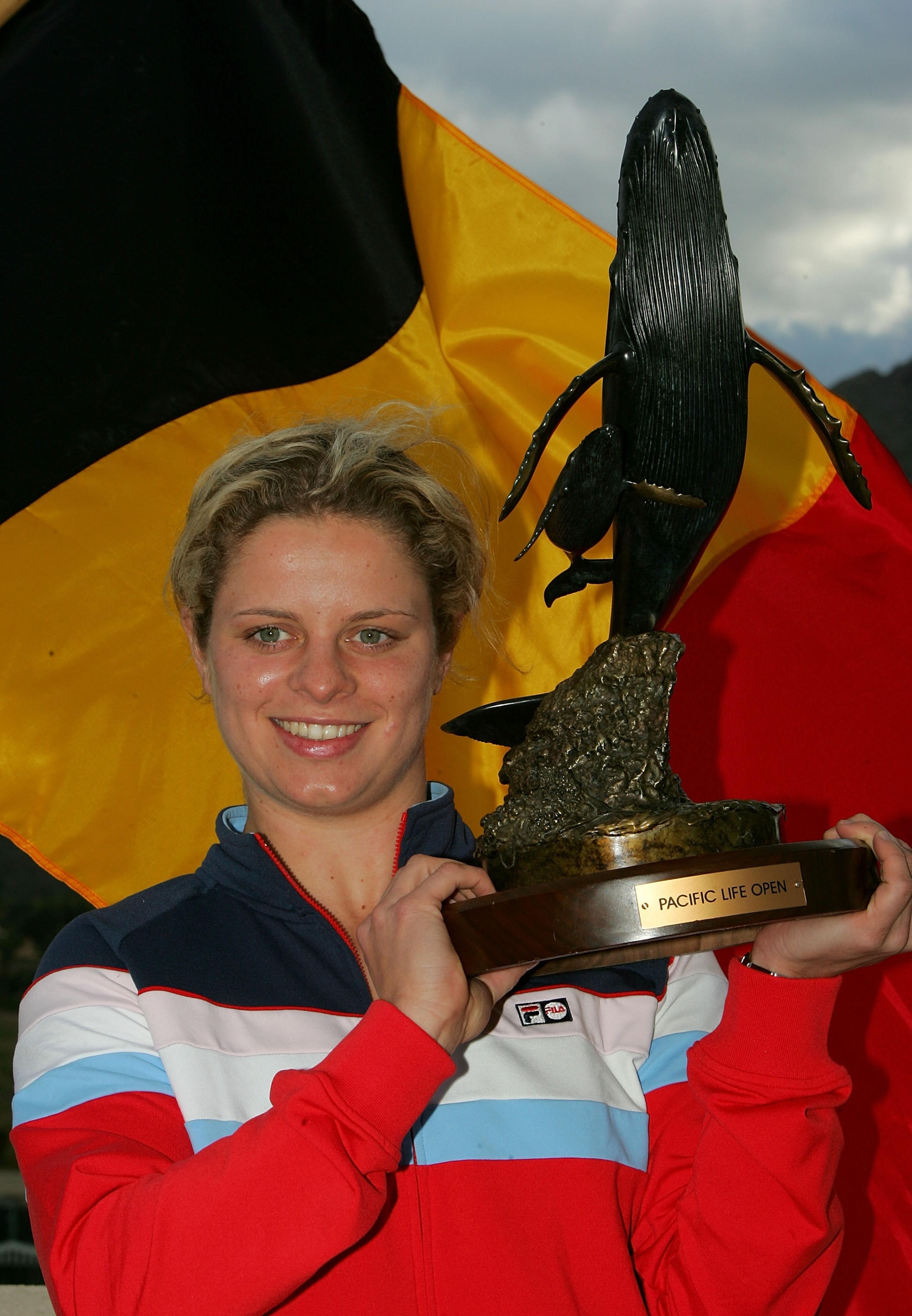 INDIAN WELLS, CA - MARCH 19: Kim Clijsters of Belgium poses with the trophy after defeating Lindsay Davenport in the championship final of the Pacific Life Open at the Indian Wells Tennis Garden on March 19, 2005 in Indian Wells, California. Clijstes wo INDIAN WELLS, CA - MARCH 19: Kim Clijsters of Belgium poses with the trophy after defeating Lindsay Davenport in the championship final of the Pacific Life Open at the Indian Wells Tennis Garden on March 19, 2005 in Indian Wells, California. Clijstes wo