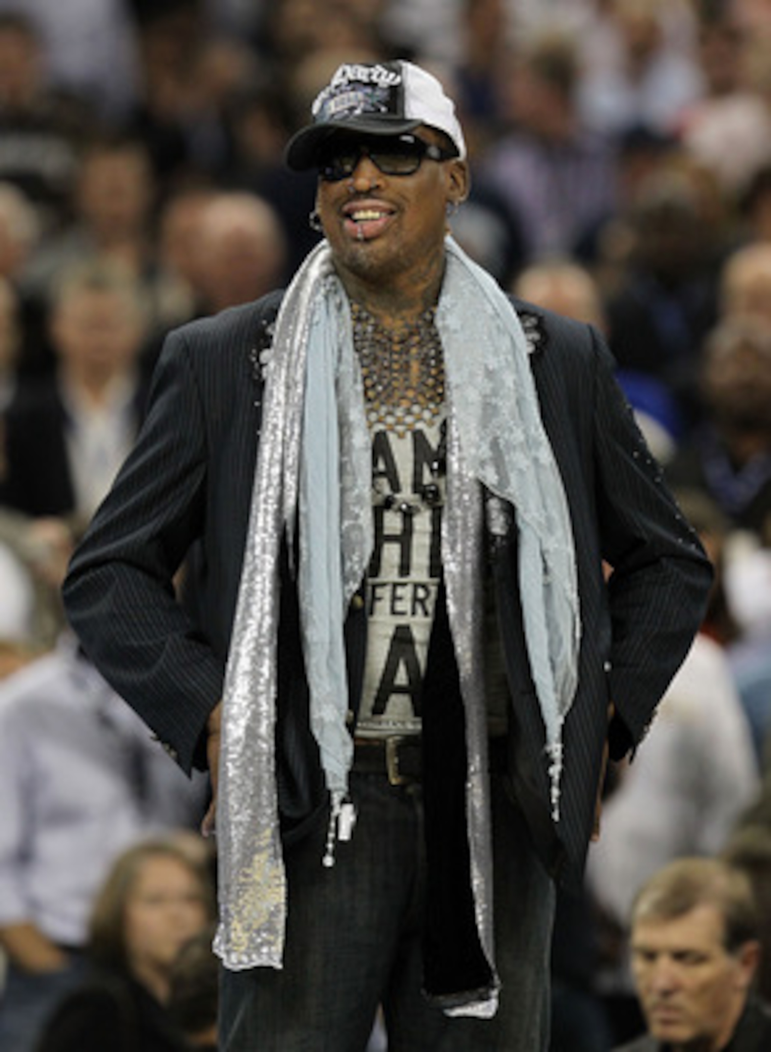 HOUSTON, TX - APRIL 04:  Naismith Memorial Basketball Hall of Fame 2011 inductee Dennis Rodman looks on during halftime of the National Championship Game of the 2011 NCAA Division I Men's Basketball Tournament at Reliant Stadium on April 4, 2011 in Housto