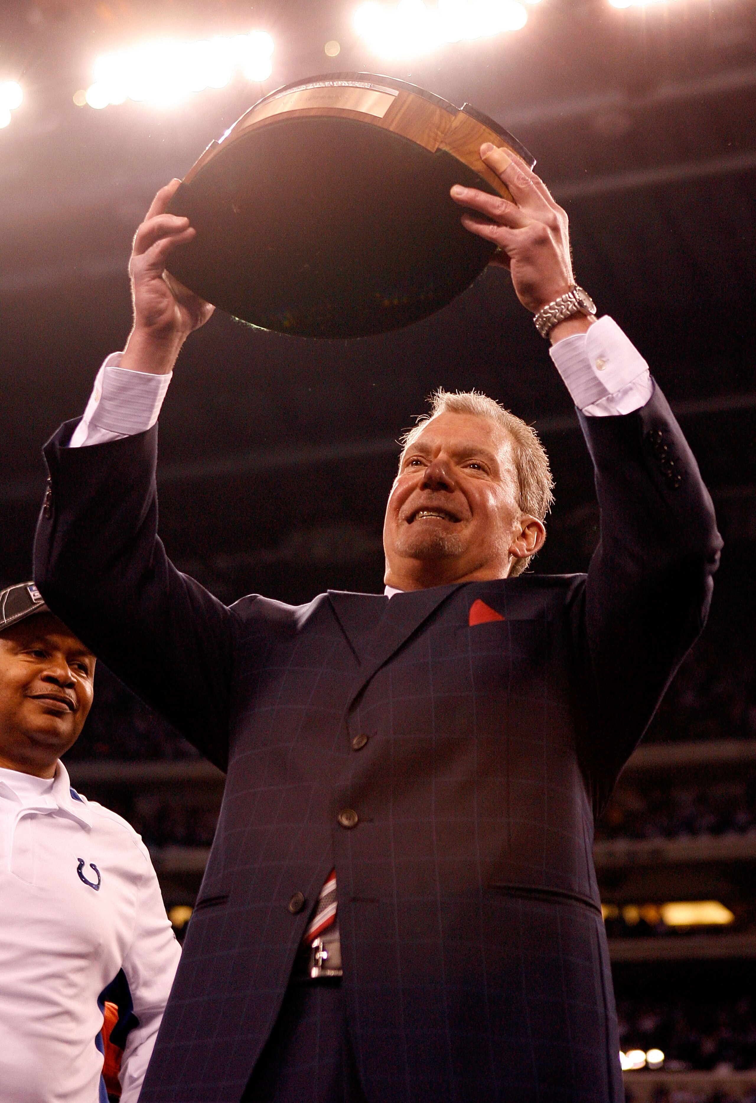 INDIANAPOLIS - JANUARY 24:  Team owner Jim Irsay of the Indianapolis Colts holds the Lamar Hunt trophy after the Colts defeated the New York Jets 30-17 to win the AFC Championship Game at Lucas Oil Stadium on January 24, 2010 in Indianapolis, Indiana.  (P