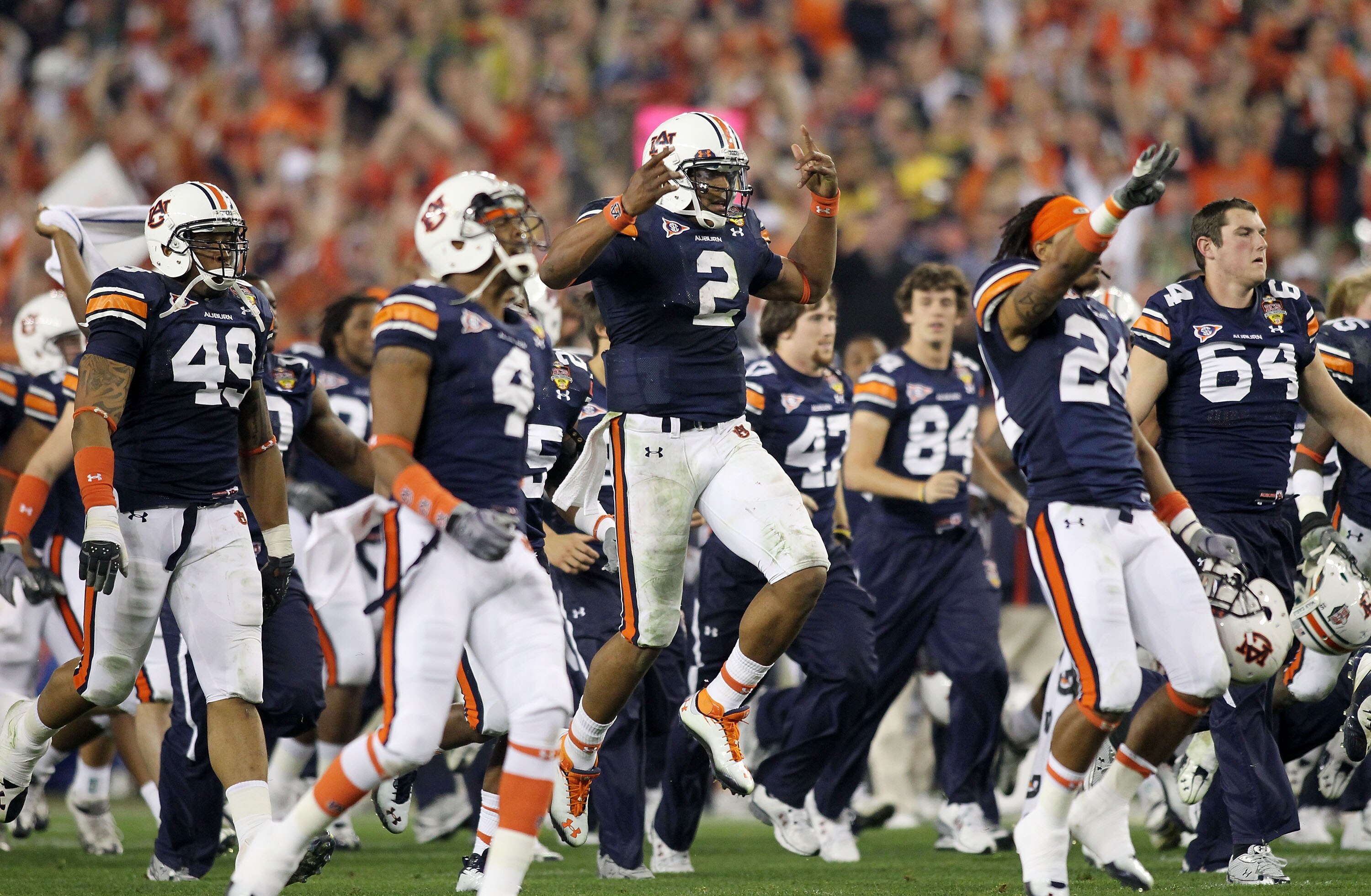 GLENDALE, AZ - JANUARY 10:  Quarterback Cameron Newton #2 of the Auburn Tigers celebrates the Tigers 22-19 victory with his team after defeating the Oregon Ducks in the Tostitos BCS National Championship Game at University of Phoenix Stadium on January 10