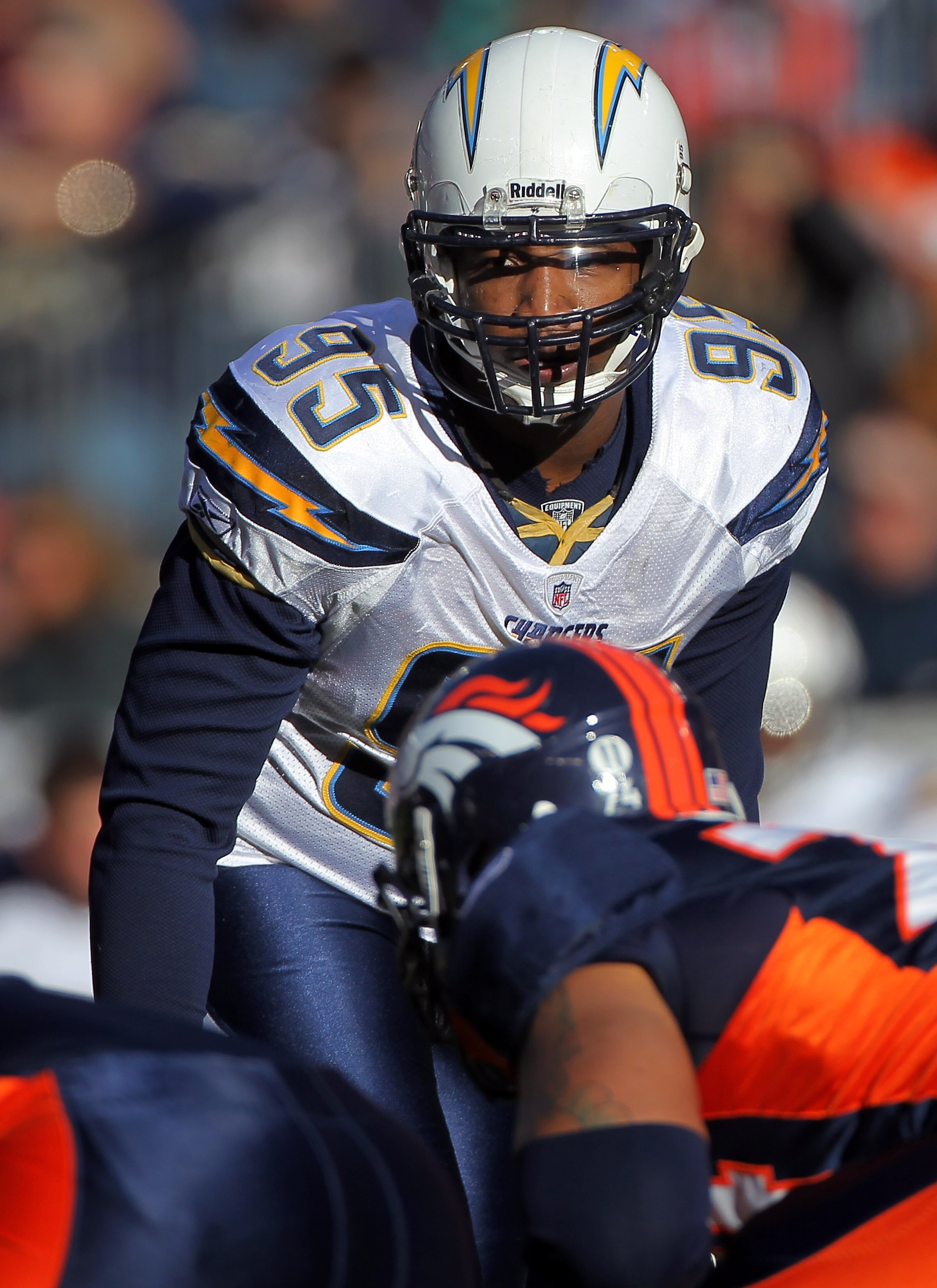 DENVER - JANUARY 02:  Outside linebacker Shaun Phillips #95 of the San Diego Chargers defends against the Denver Broncos at INVESCO Field at Mile High on January 2, 2011 in Denver, Colorado. The Chargers defeated the Broncos 33-28.  (Photo by Doug Pensing