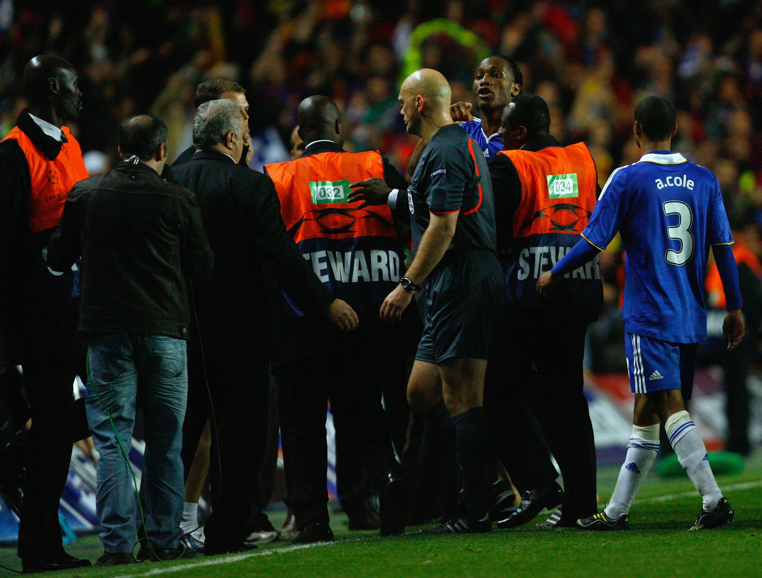LONDON, ENGLAND - MAY 06:  Didier Drogba of Chelsea argues with the referee in front of caretaker manager of Chelsea Guus Hiddink after the UEFA Champions League Semi Final Second Leg match between Chelsea and Barcelona at Stamford Bridge on May 6, 2009 i