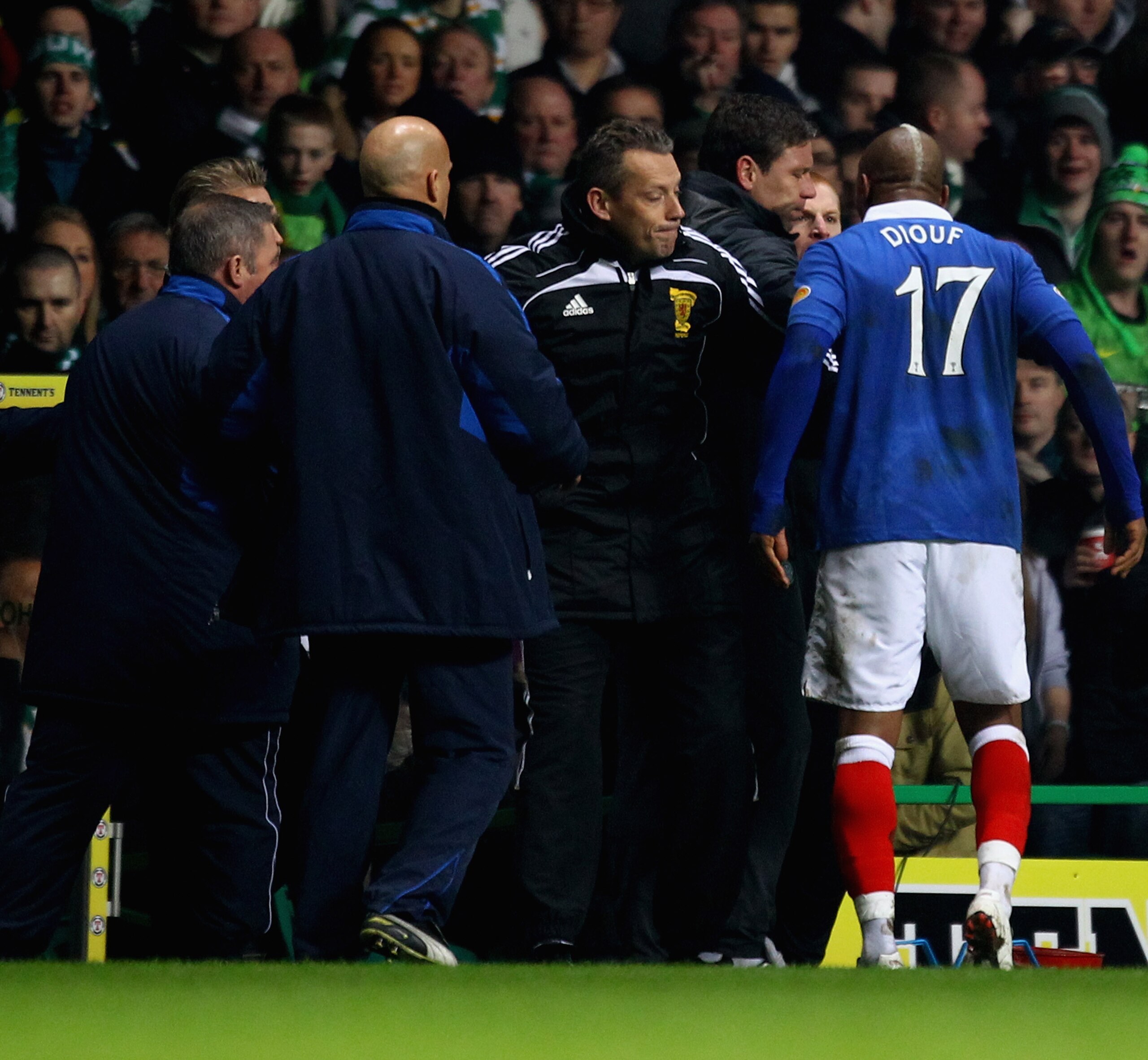 GLASGOW, SCOTLAND - MARCH 02:  Neil Lennon coach of Celtic reacts with El Hadji Diouf #17 of Rangers during the Scottish Cup fifth round match between Celtic and Rangers at Celtic Park on March 2, 2011 in Glasgow, Scotland. (Photo by Jeff J Mitchell/Getty