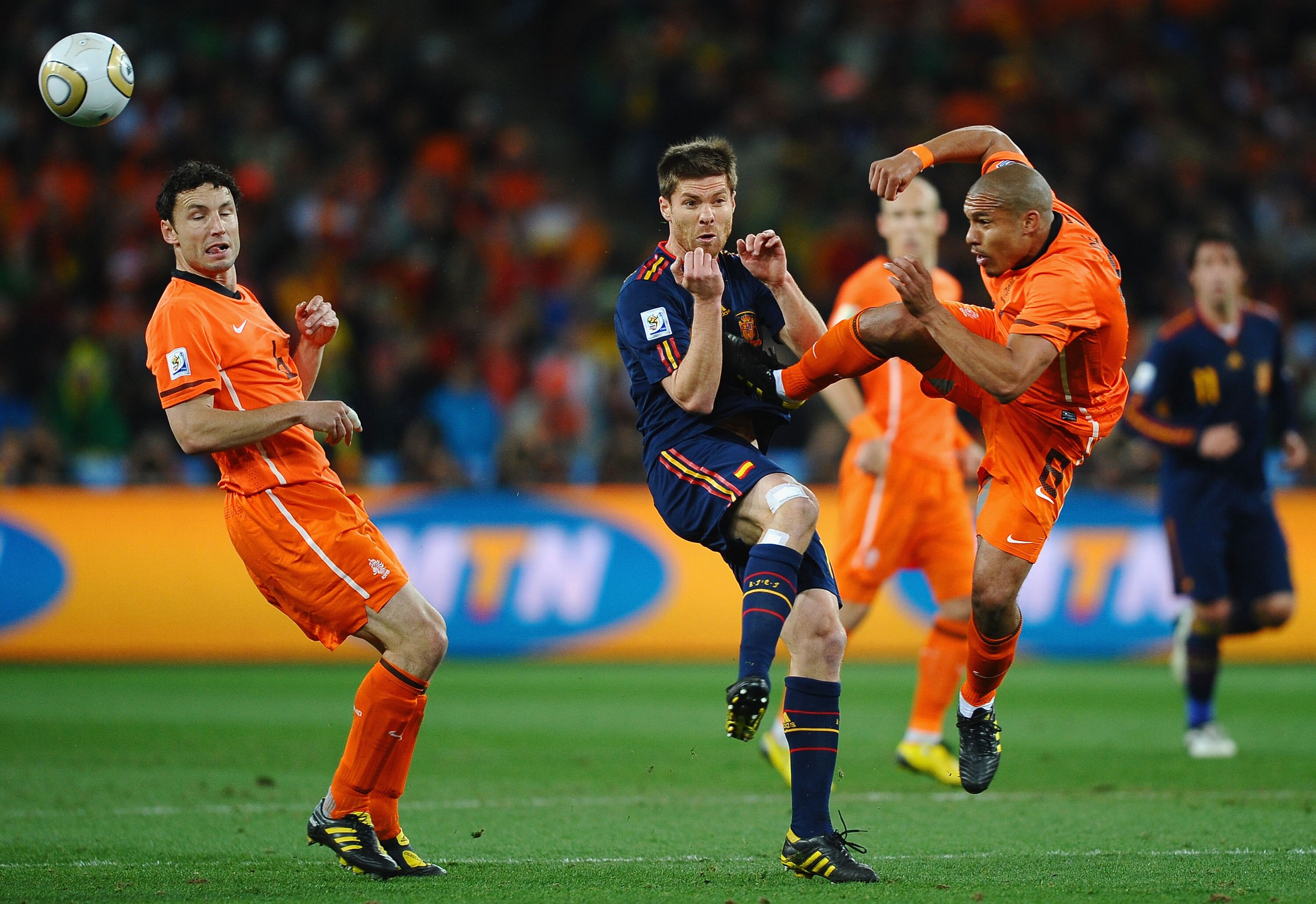 JOHANNESBURG, SOUTH AFRICA - JULY 11:  Nigel De Jong of the Netherlands tackles Xabi Alonso of Spain with a kick in the chest during the 2010 FIFA World Cup South Africa Final match between Netherlands and Spain at Soccer City Stadium on July 11, 2010 in