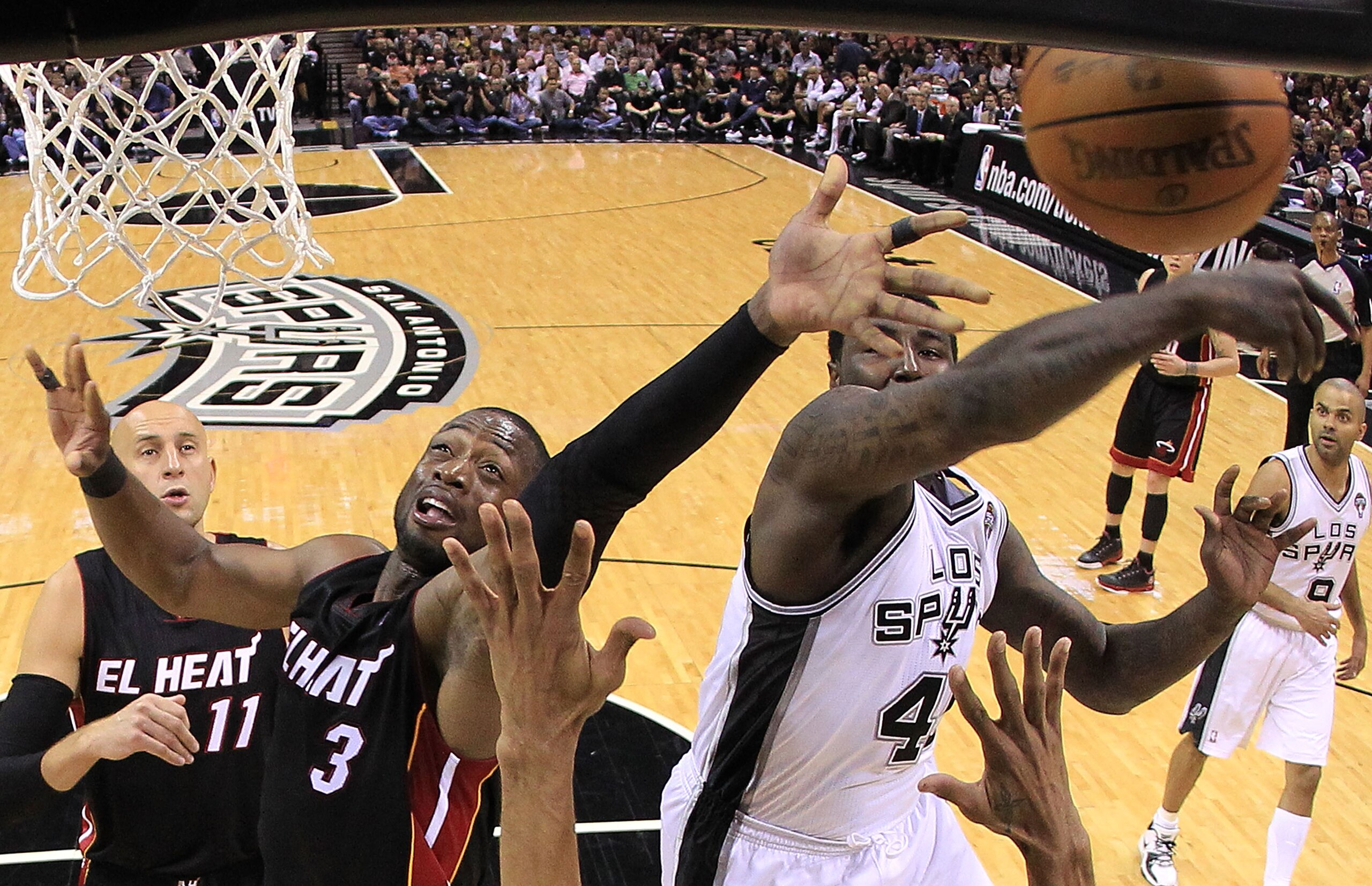 SAN ANTONIO, TX - MARCH 04: Forward DeJuan Blair #45 of the San Antonio Spurs blocks a shot by Dwyane Wade #3 of the Miami Heat at AT&T Center on March 4, 2011 in San Antonio, Texas. NOTE TO USER: User expressly acknowledges and agrees that, by downloa SAN ANTONIO, TX - MARCH 04: Forward DeJuan Blair #45 of the San Antonio Spurs blocks a shot by Dwyane Wade #3 of the Miami Heat at AT&T Center on March 4, 2011 in San Antonio, Texas. NOTE TO USER: User expressly acknowledges and agrees that, by downloa