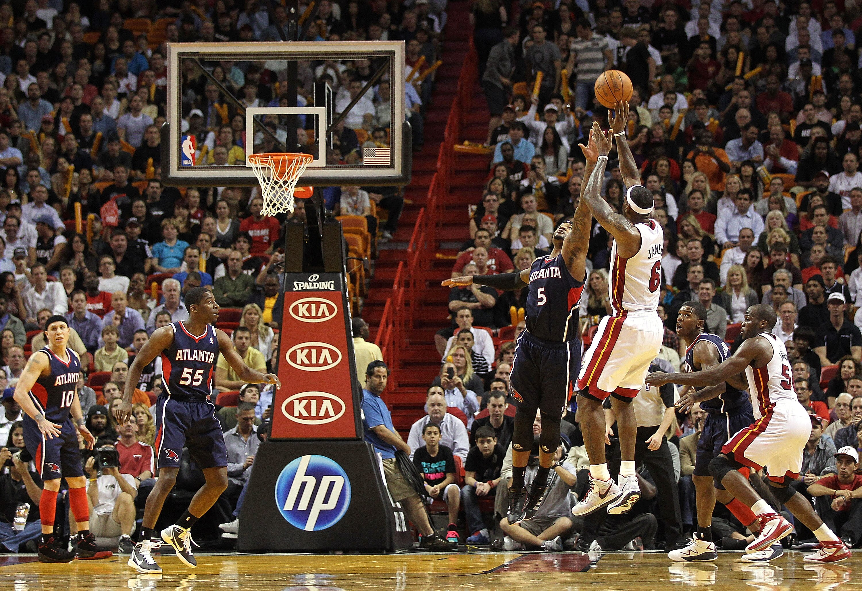 MIAMI, FL - JANUARY 18:  LeBron James #6 of the Miami Heat shoots over Josh Smith #5 of the Atlanta Hawks during a game at American Airlines Arena on January 18, 2011 in Miami, Florida. NOTE TO USER: User expressly acknowledges and agrees that, by downloa