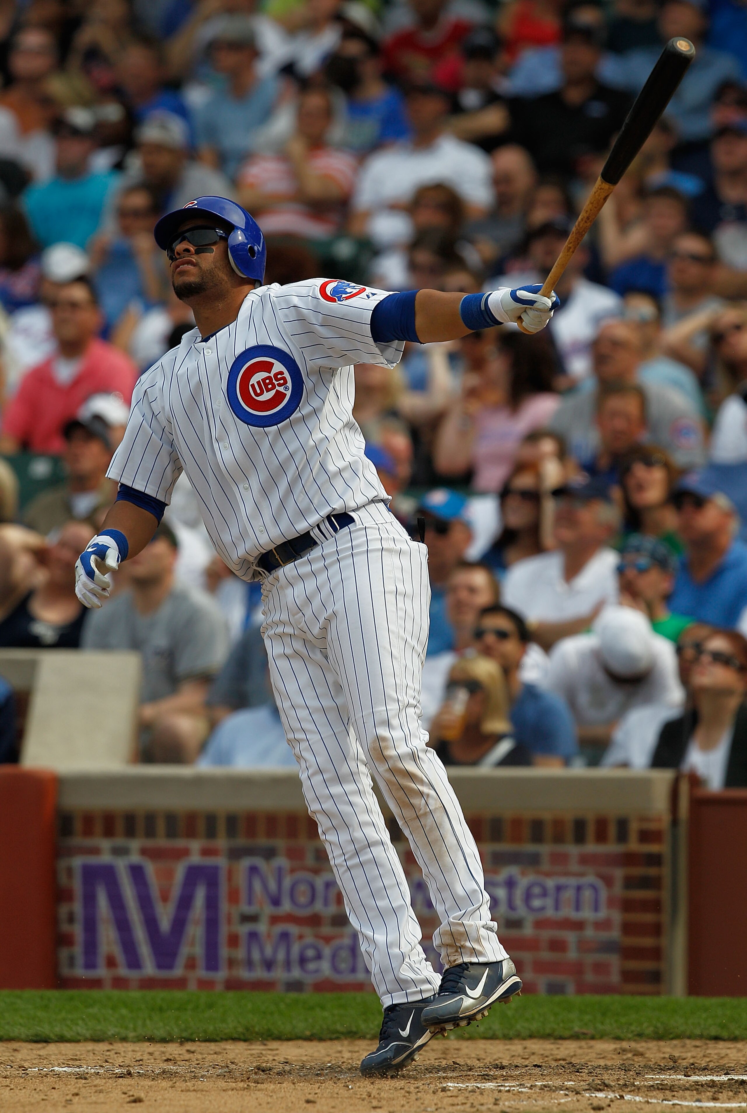 CHICAGO - APRIL 15: Aramis Ramirez of the Chicago Cubs, wearing a number 42 jersey in honor of Jackie Robinson, hops after hitting a home run against the Milwaukee Brewers in the 6th inning at Wrigley Field on April 15, 2010 in Chicago, Illinois. (Photo b