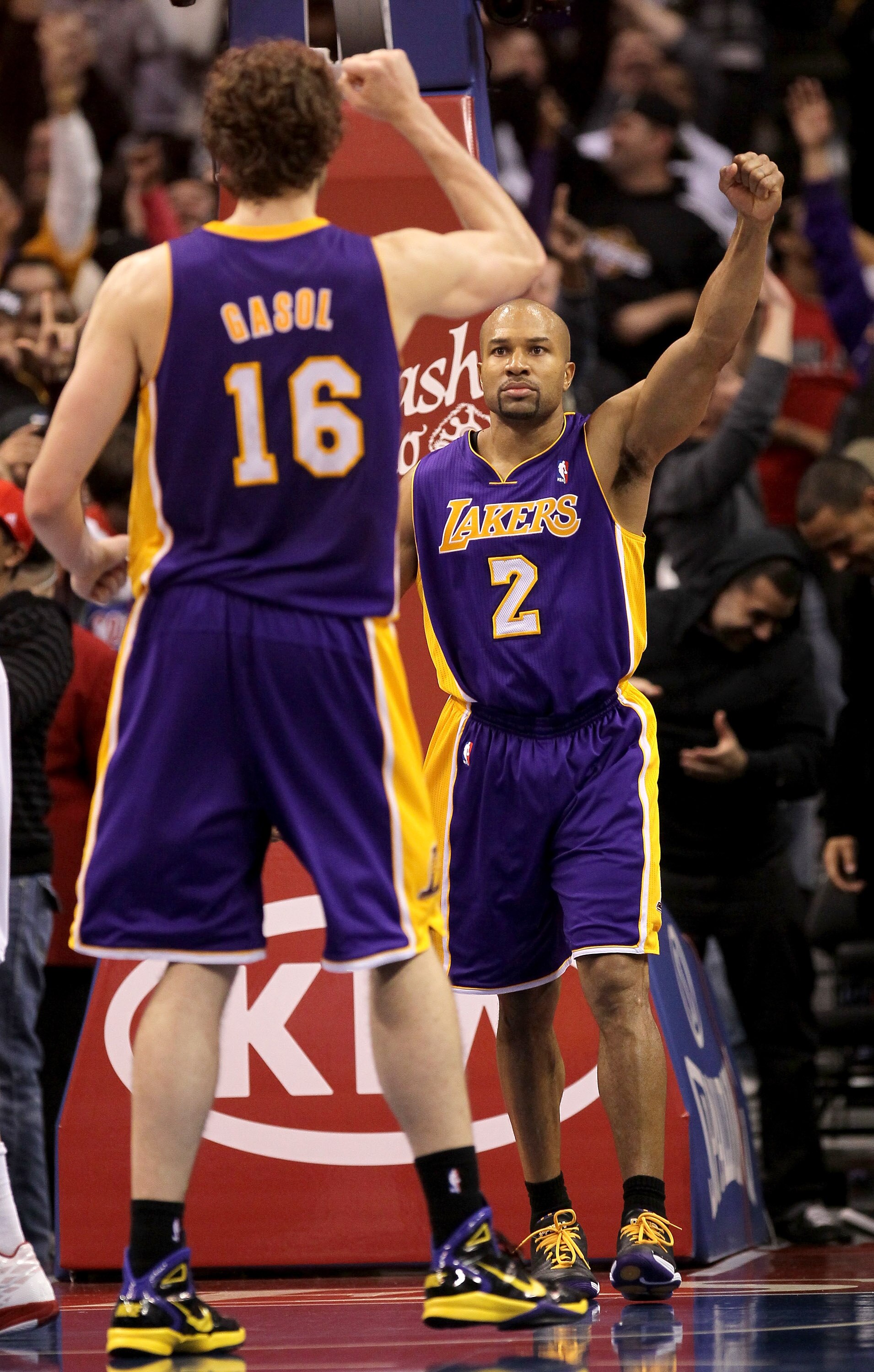 LOS ANGELES, CA - DECEMBER 8: Derek Fisher #2 and Pau Gasol #7 of the Los Angeles Lakers celebrate after Fisher's shot at the buzzer put the Lakers ahead for the victory against the Los Angeles Clippers at Staples Center on December 8, 2010 in Los Angele LOS ANGELES, CA - DECEMBER 8: Derek Fisher #2 and Pau Gasol #7 of the Los Angeles Lakers celebrate after Fisher's shot at the buzzer put the Lakers ahead for the victory against the Los Angeles Clippers at Staples Center on December 8, 2010 in Los Angele