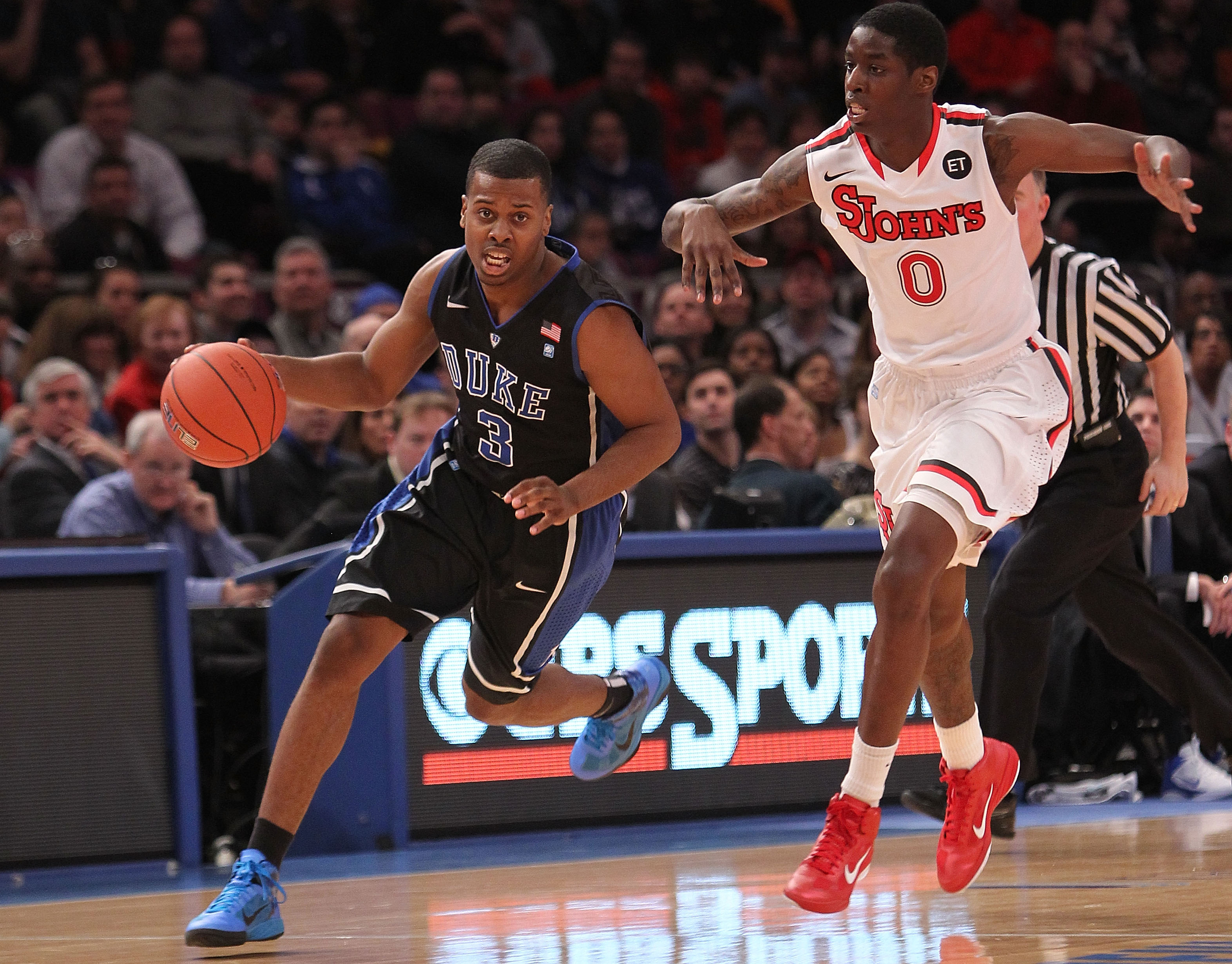 NEW YORK, NY - JANUARY 30:  Tyler Thornton #3 of the Duke Blue Devils dribbles the ball against Dwayne Polee II #0 of the St. John's Red Storm at Madison Square Garden on January 30, 2011 in New York City.  (Photo by Nick Laham/Getty Images)