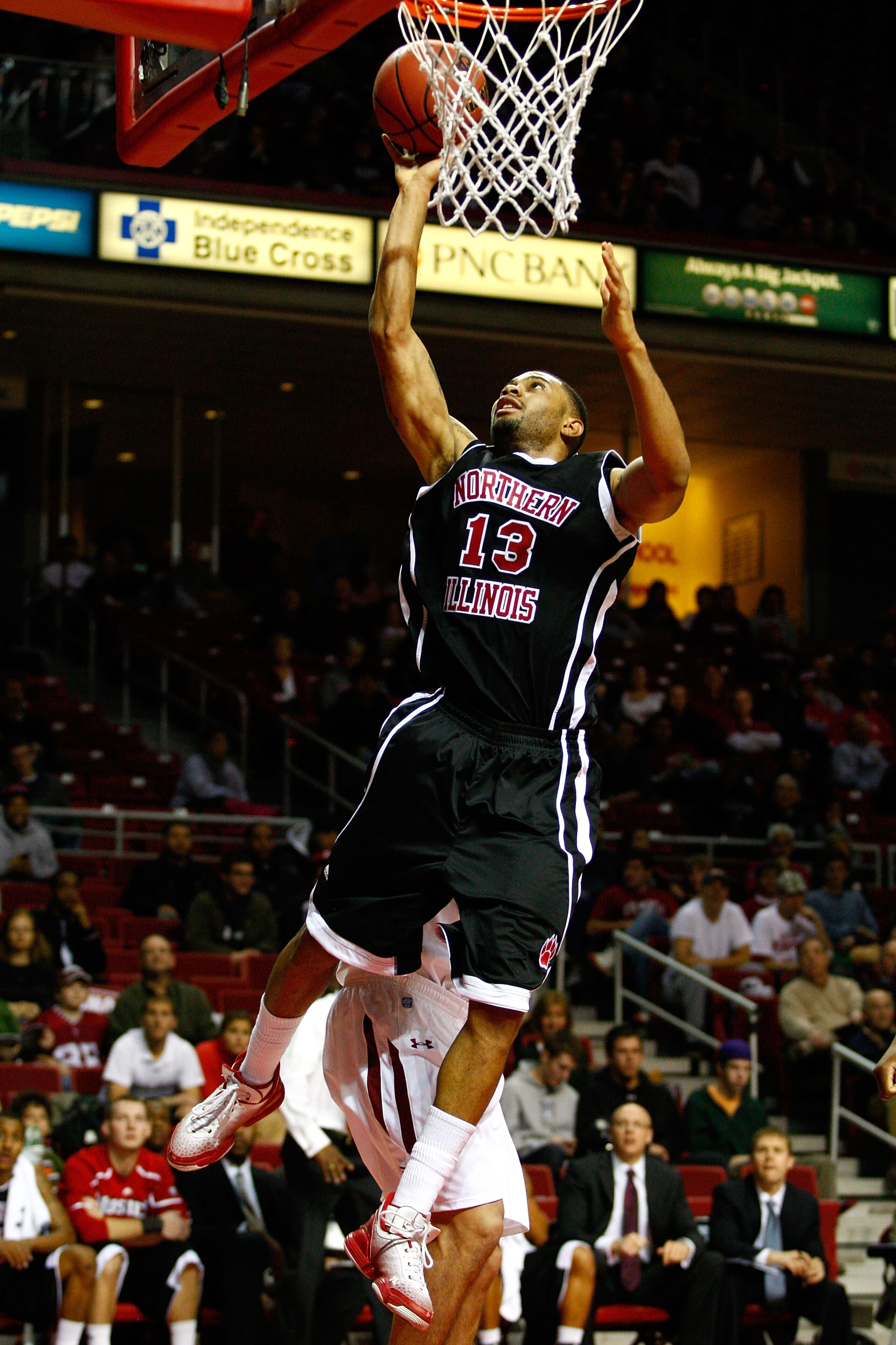 PHILADELPHIA, PA - DECEMBER 18:  Xavier Silas #13 of the Northern Illinois Huskies drives for a shot attempt against the Temple Owls at the Liacouras Center on December 18, 2010 in Philadelphia, Pennsylvania.  (Photo by Chris Chambers/Getty Images)