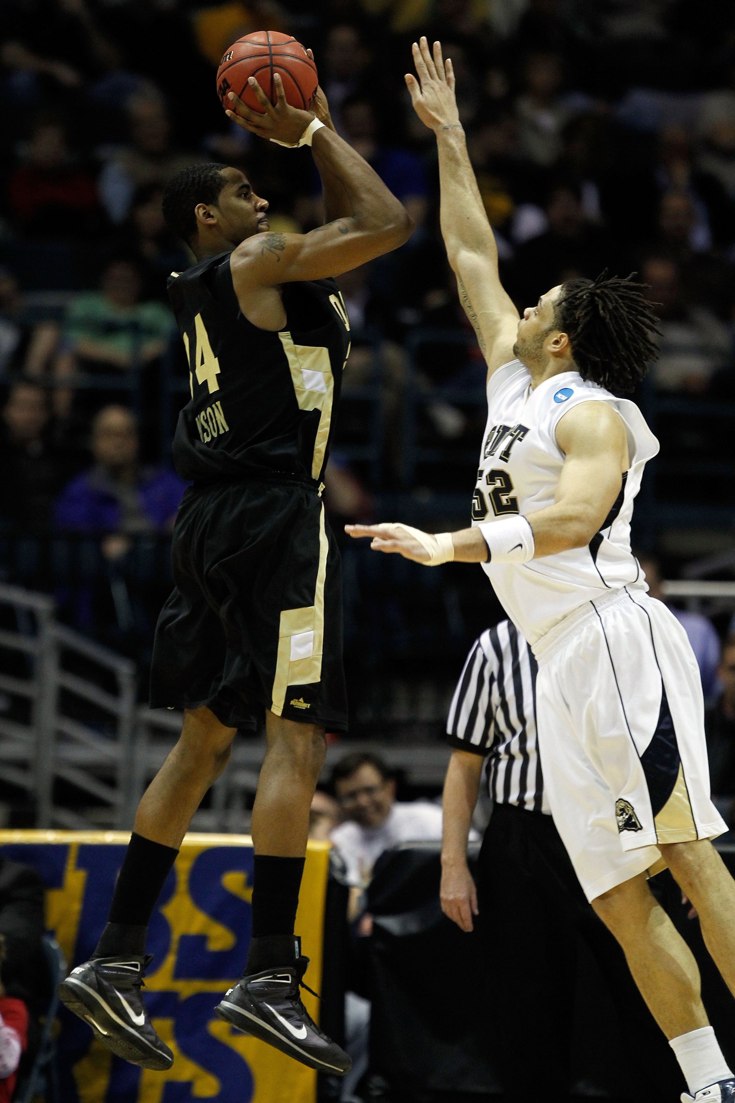 MILWAUKEE - MARCH 19:  Keith Benson #34 of the Oakland Golden Grizzlies shoots the ball over Gary McGhee #52 of the Pittsburgh Panthers in the second half during the first round of the 2010 NCAA men's basketball tournament at the Bradley Center on March 1