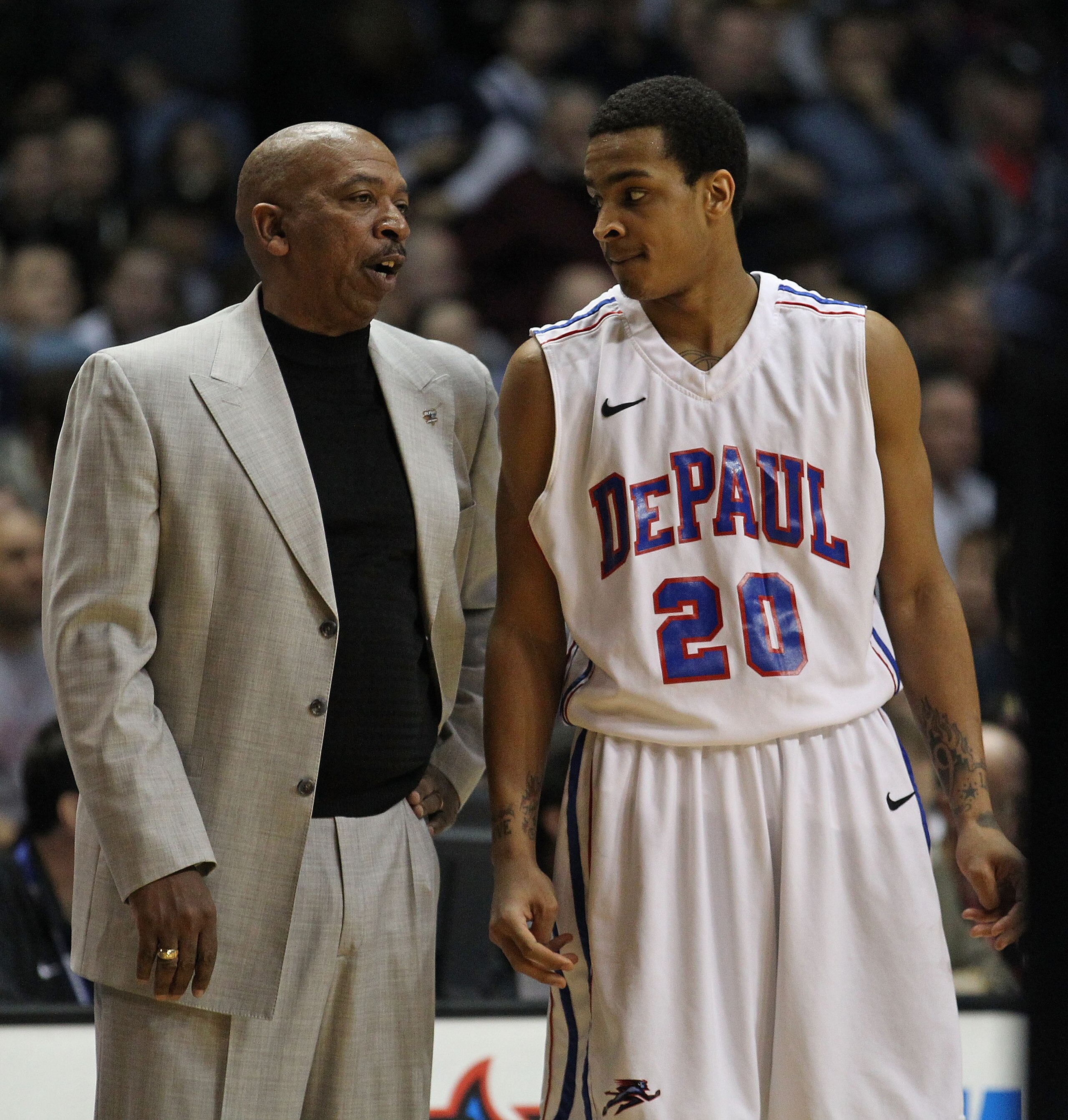 ROSEMONT, IL - FEBRUARY 19: Head coach Oliver Purnell of the DePaul Blue Demons talks with Brandon Young #20 during a game against the Villanova Wildcats at the Allstate Arena on February 19, 2011 in Rosemont, Illinois. Villanova defeated DePaul 77-75 in